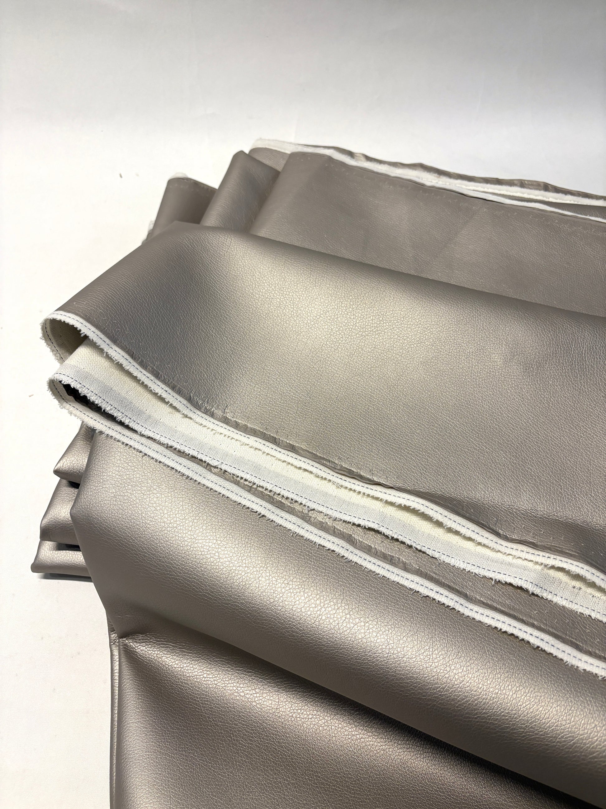 Stack of faux leather in metallic bronze 
