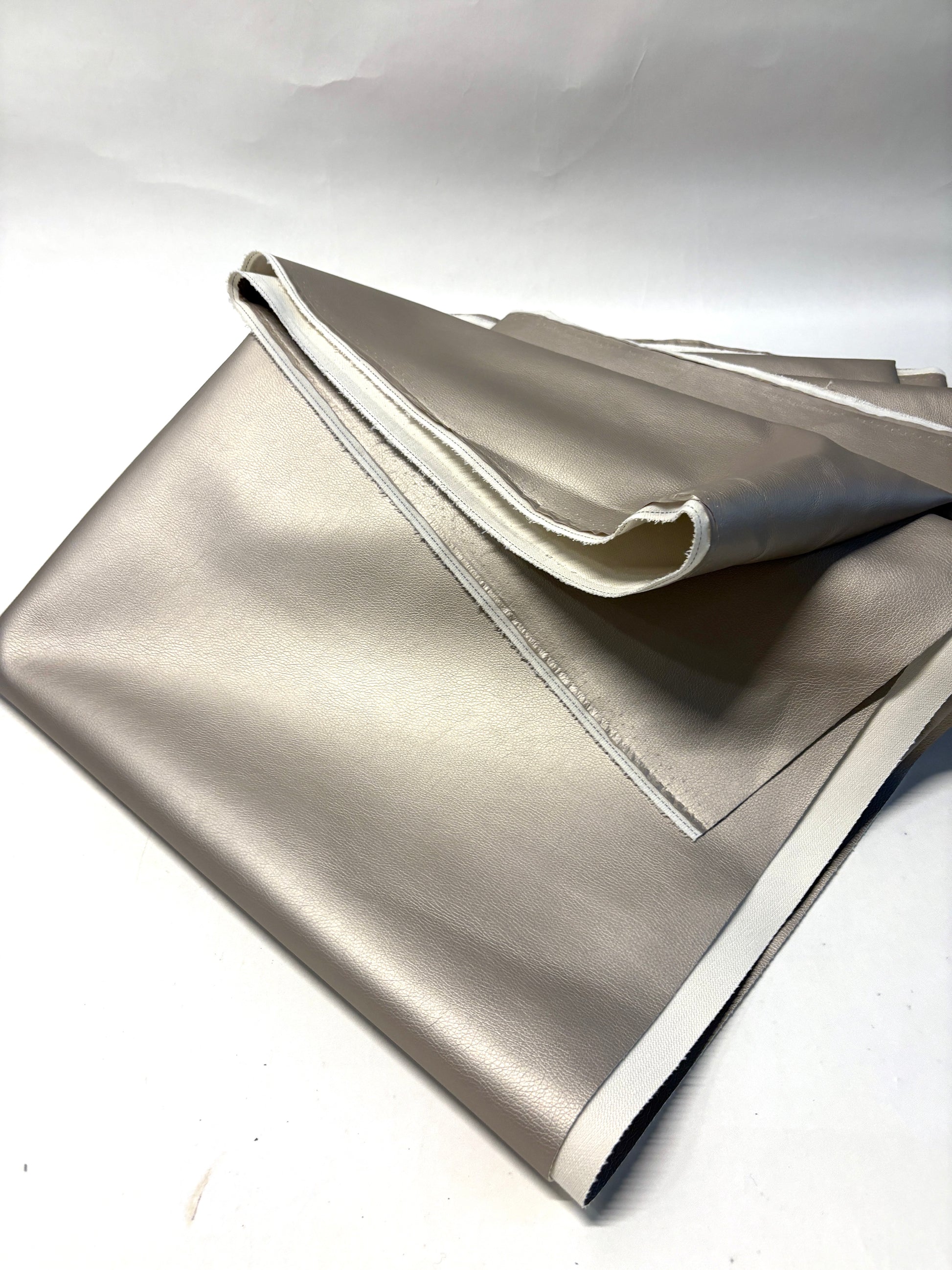 Stack of faux leather in metallic bronze 