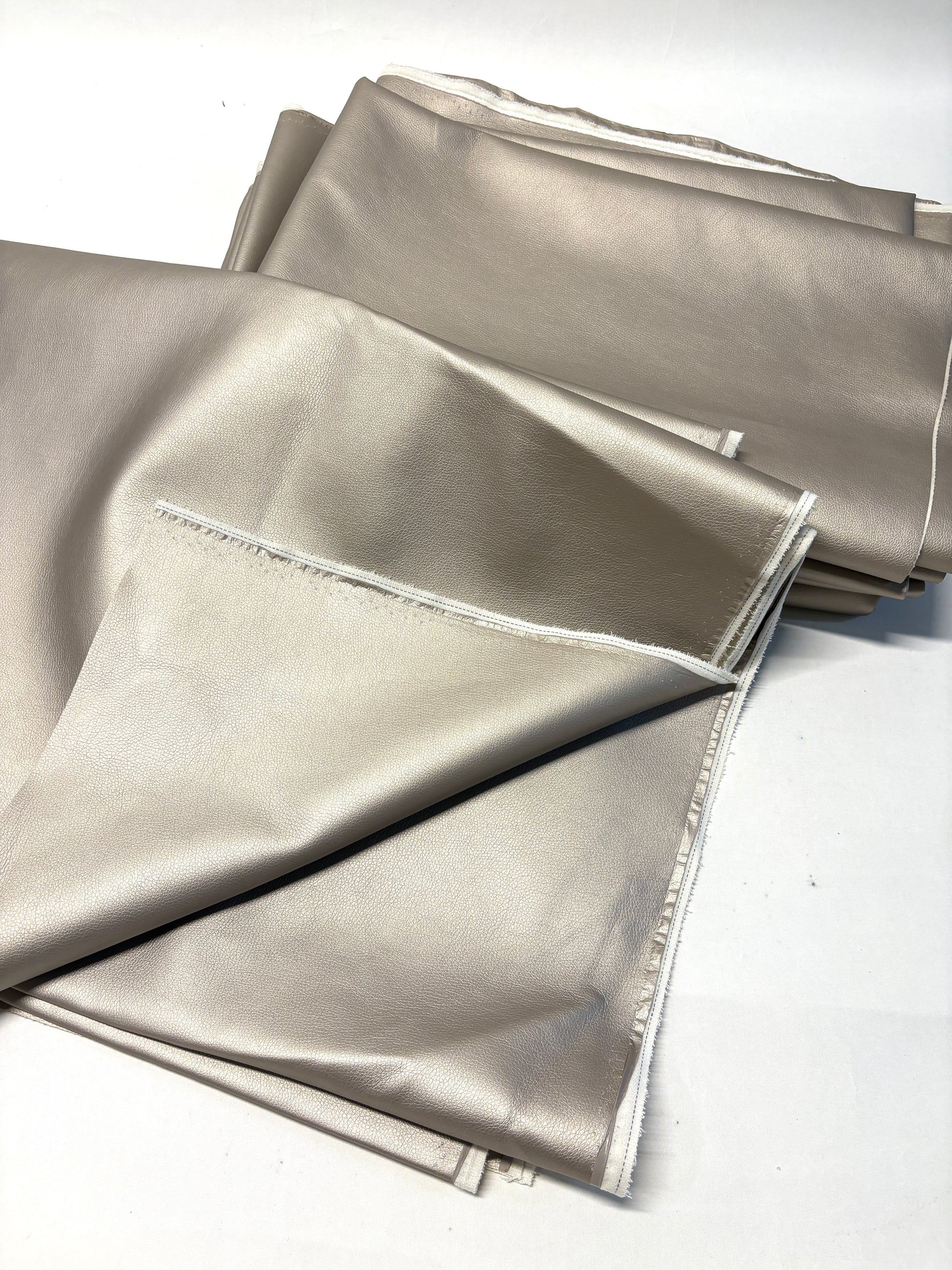Stack of faux leather in metallic bronze 
