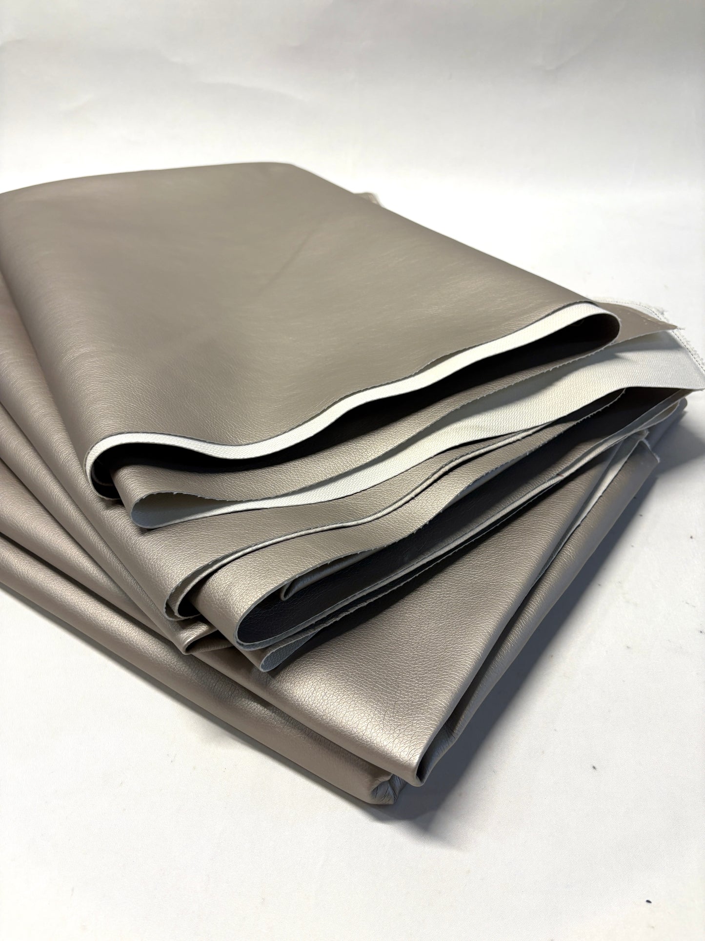Stack of faux leather in metallic bronze 