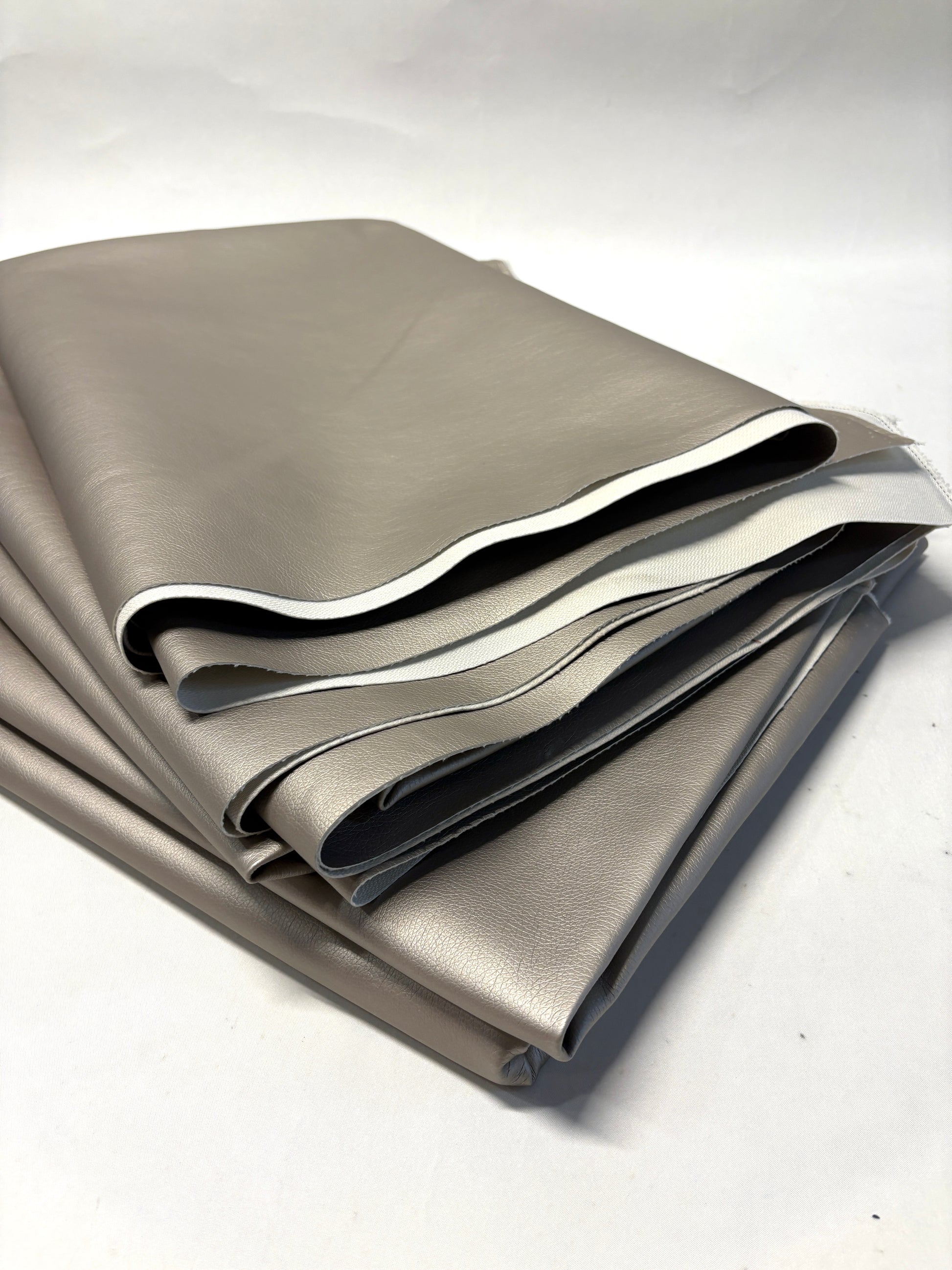 Stack of faux leather in metallic bronze 