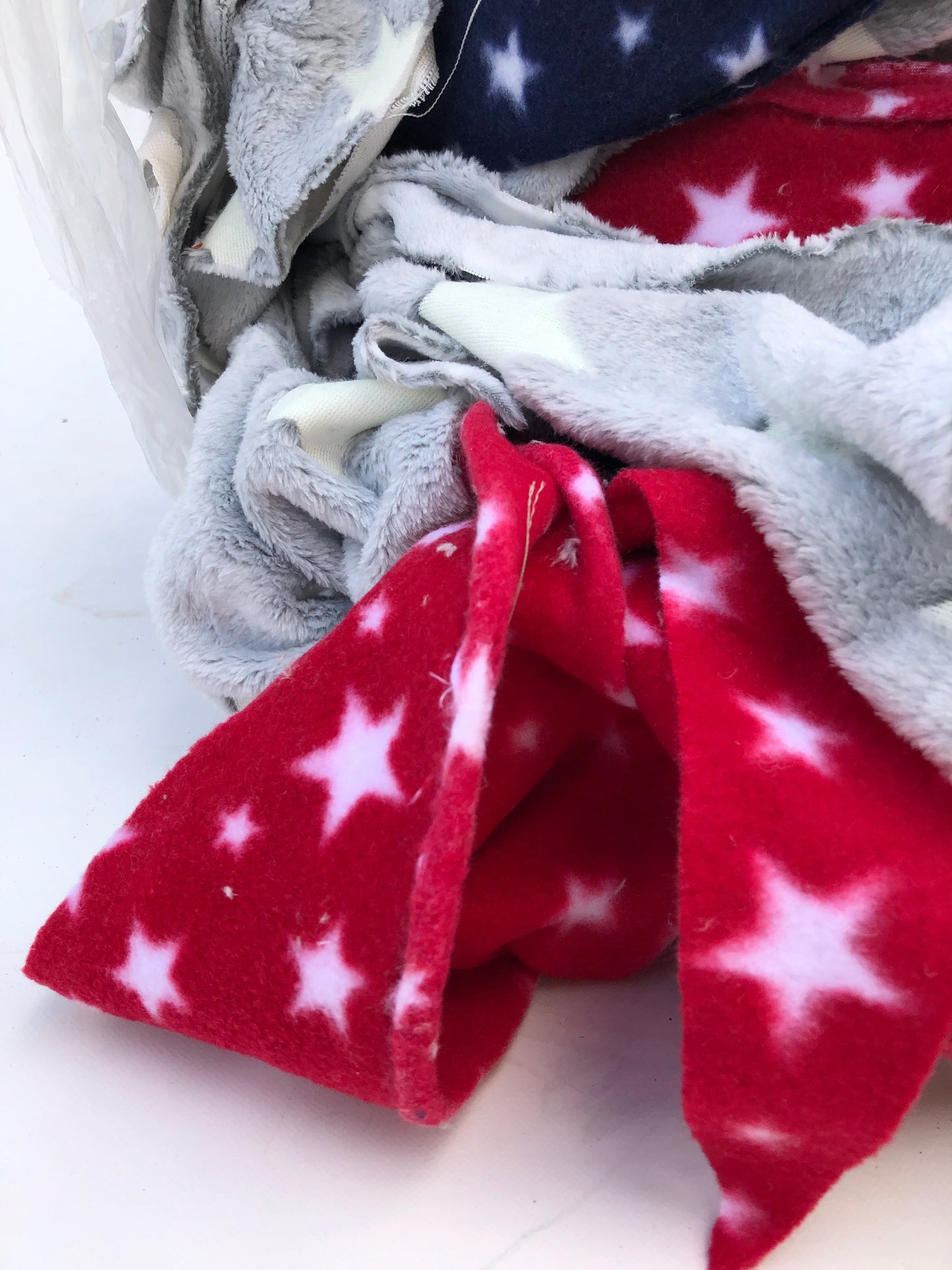Colourful fleece fabric offcuts with various patterns 