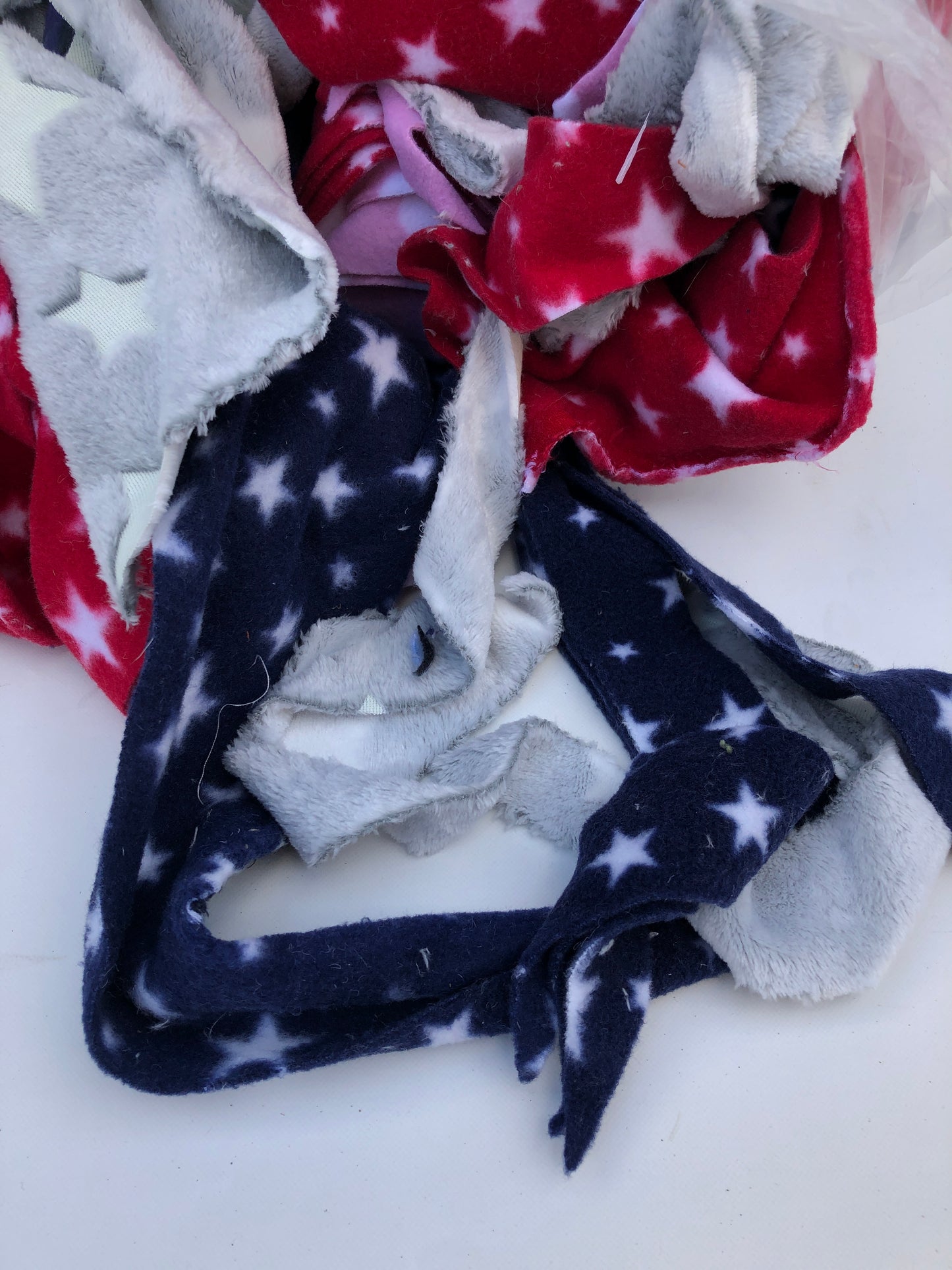 Colourful fleece fabric offcuts with various patterns 