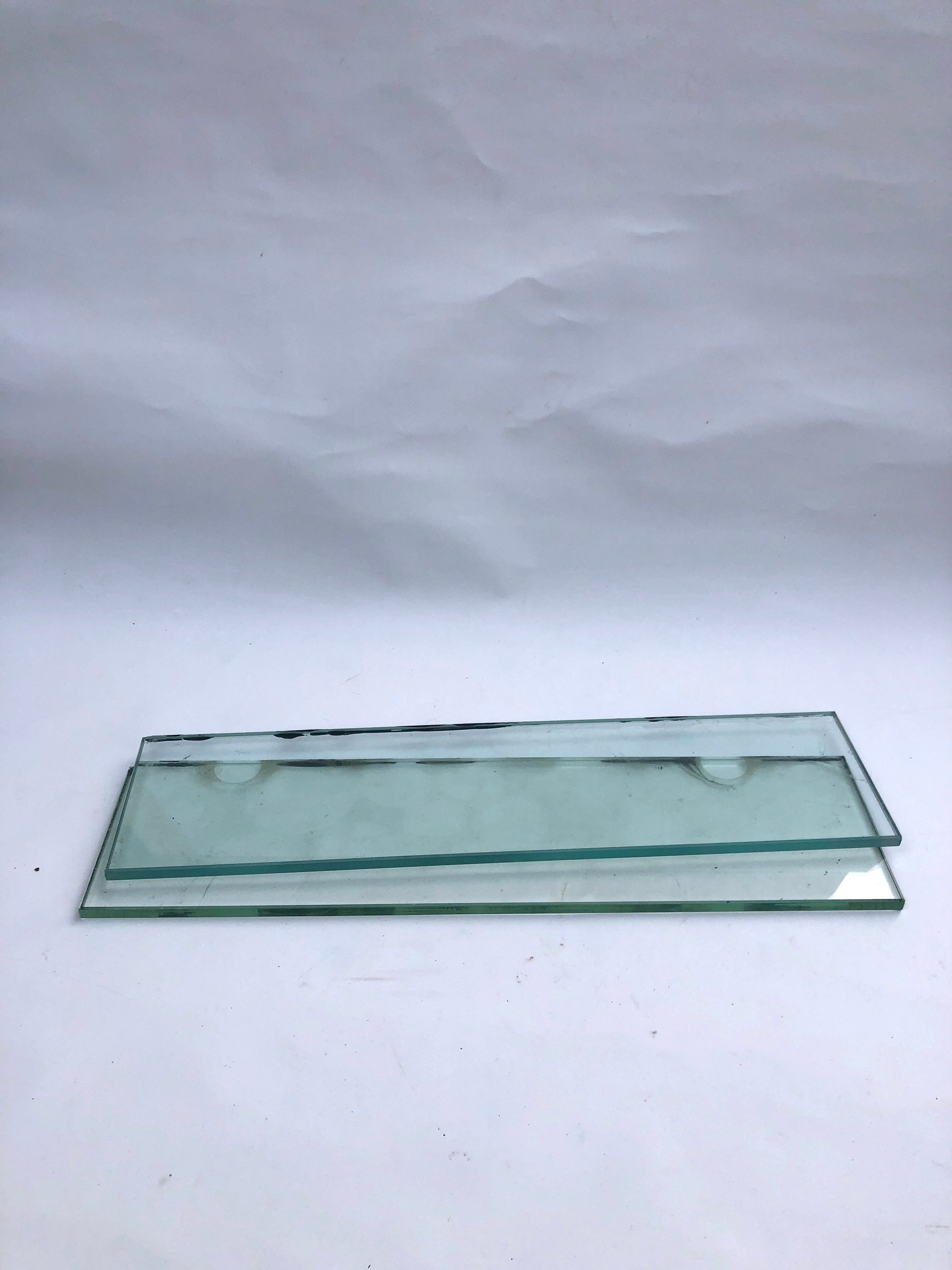 Two transparent glass plates, and something stained on them