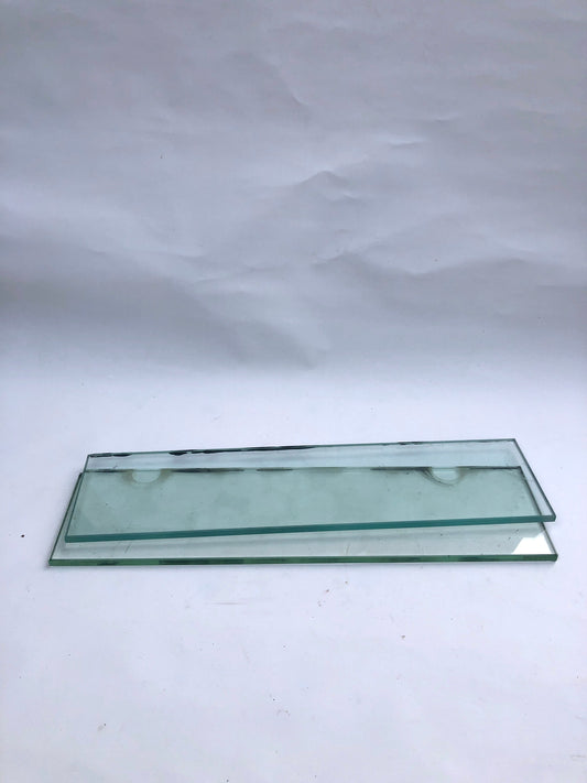 Two transparent glass plates, and something stained on them