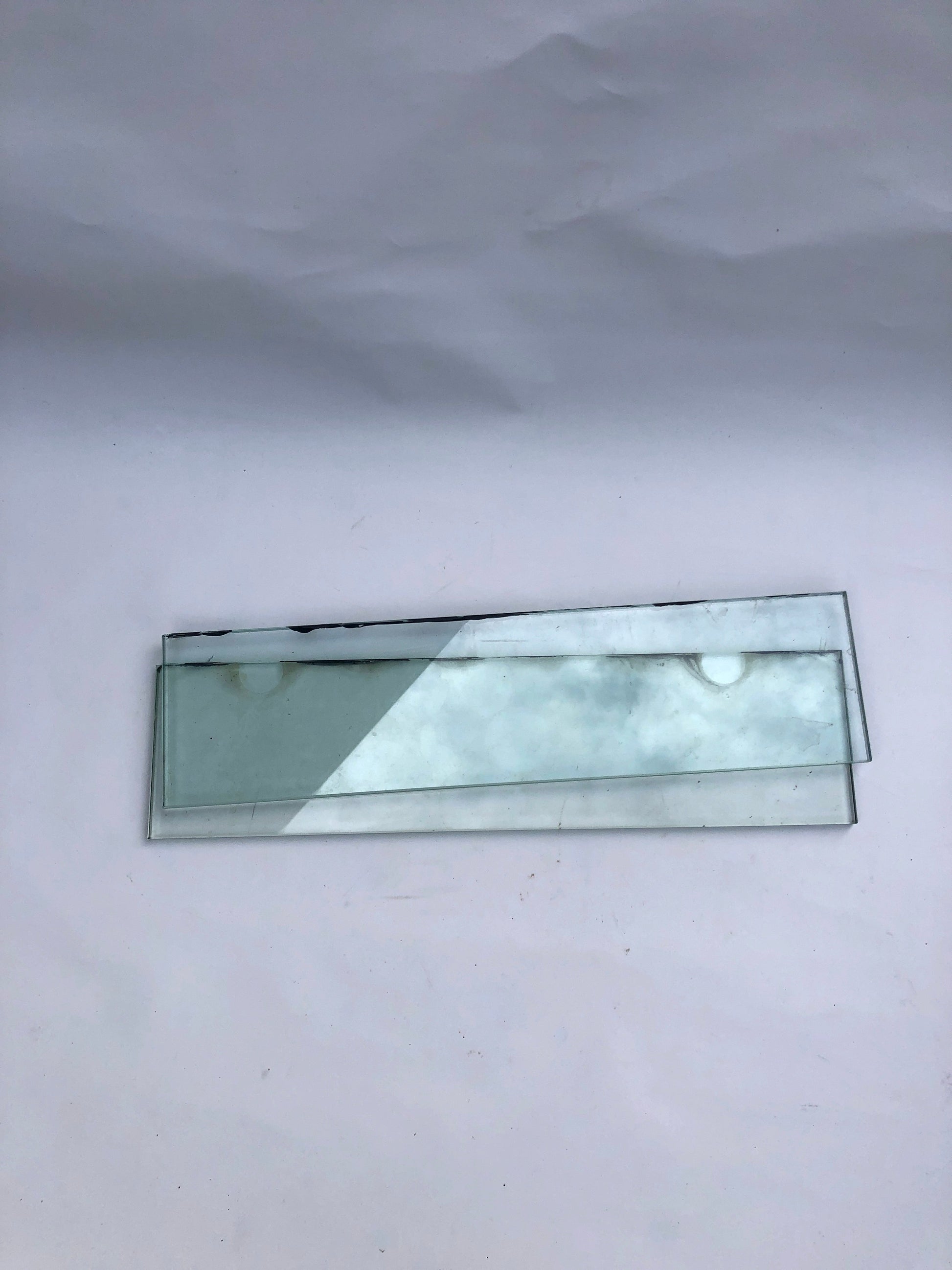     A narrow glass strip is shown on a white background
