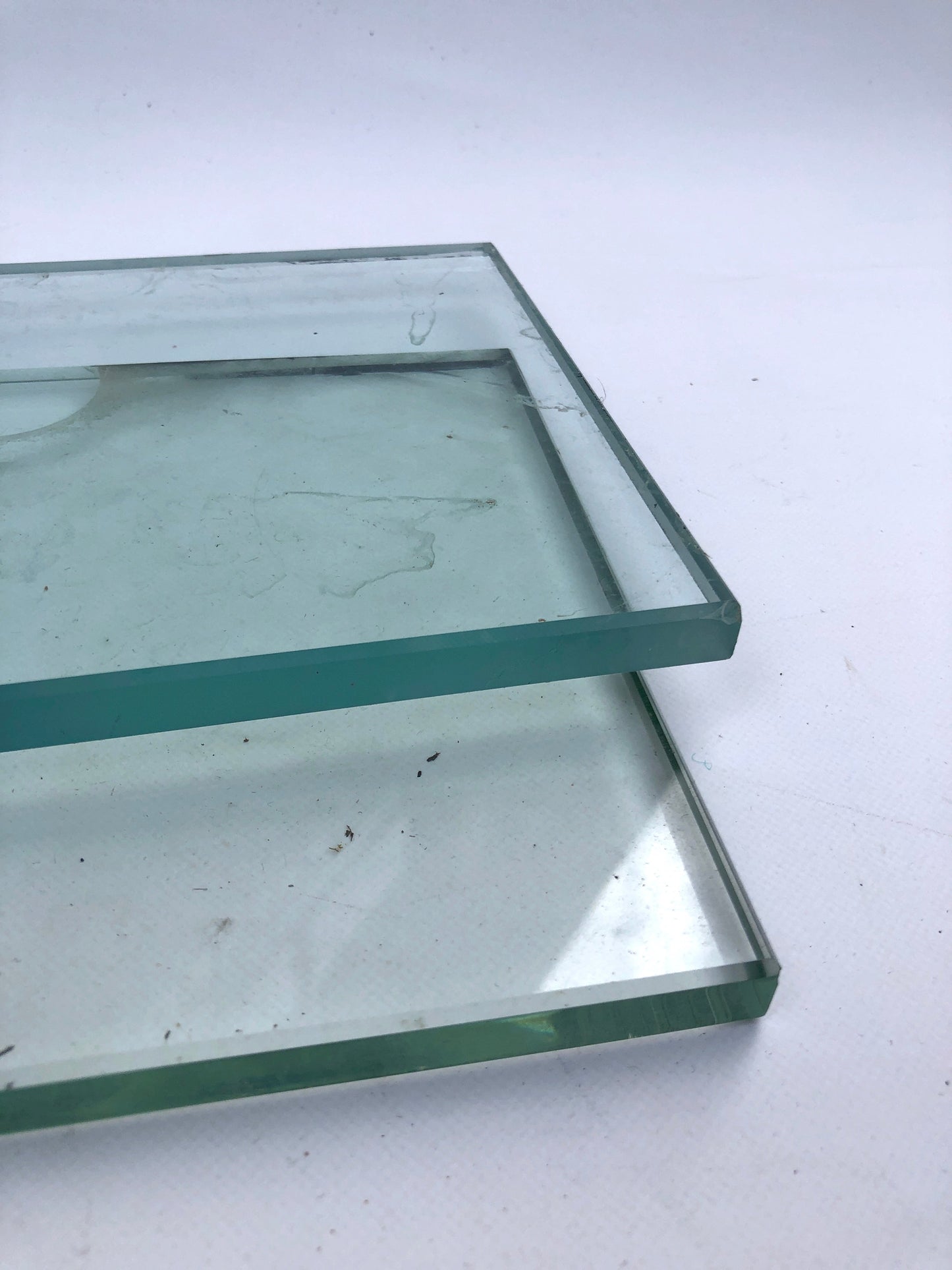     Close-up view shows layered glass sheets with green-tinted edges