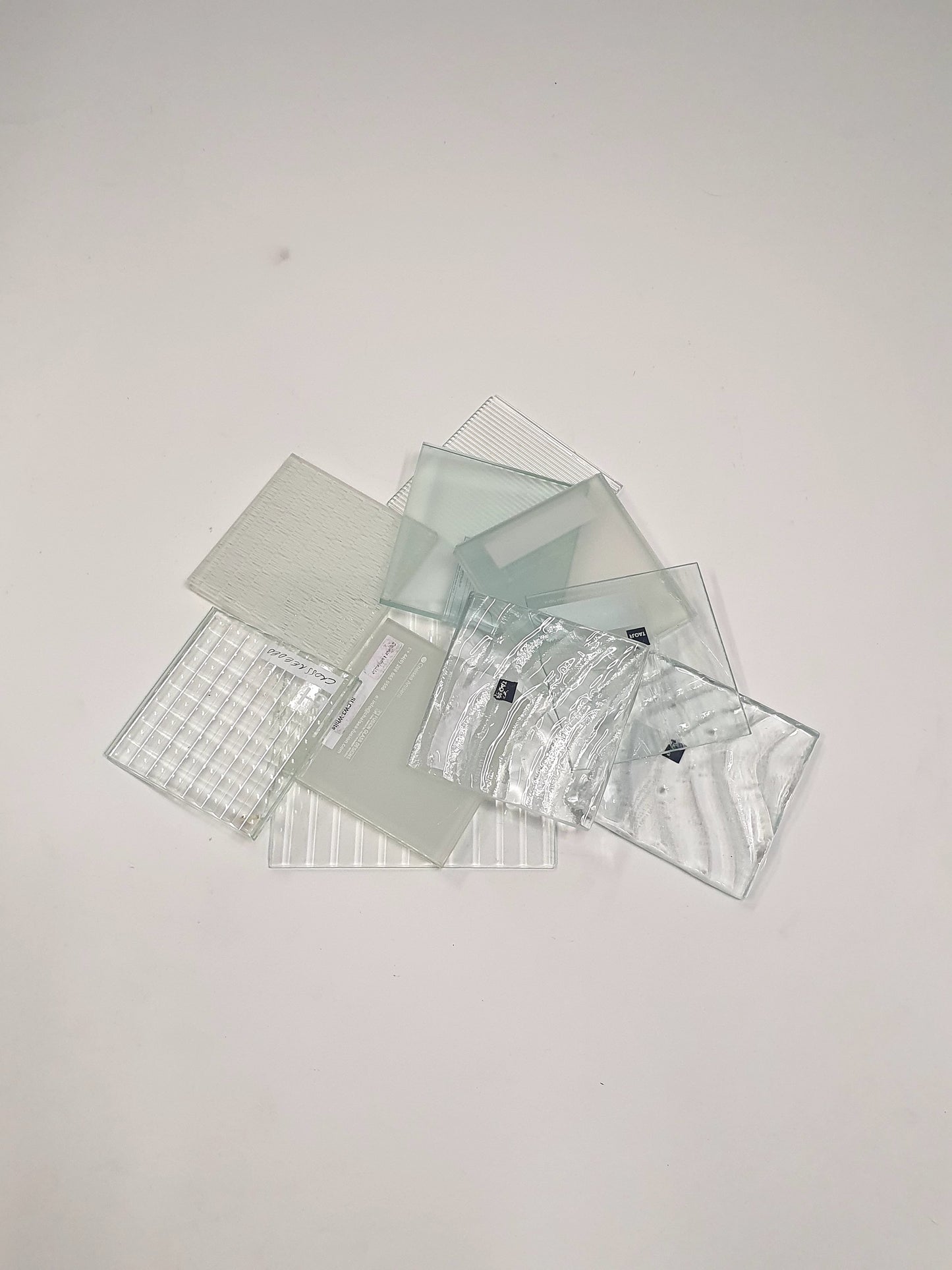 Pile of square transparent glass samples 