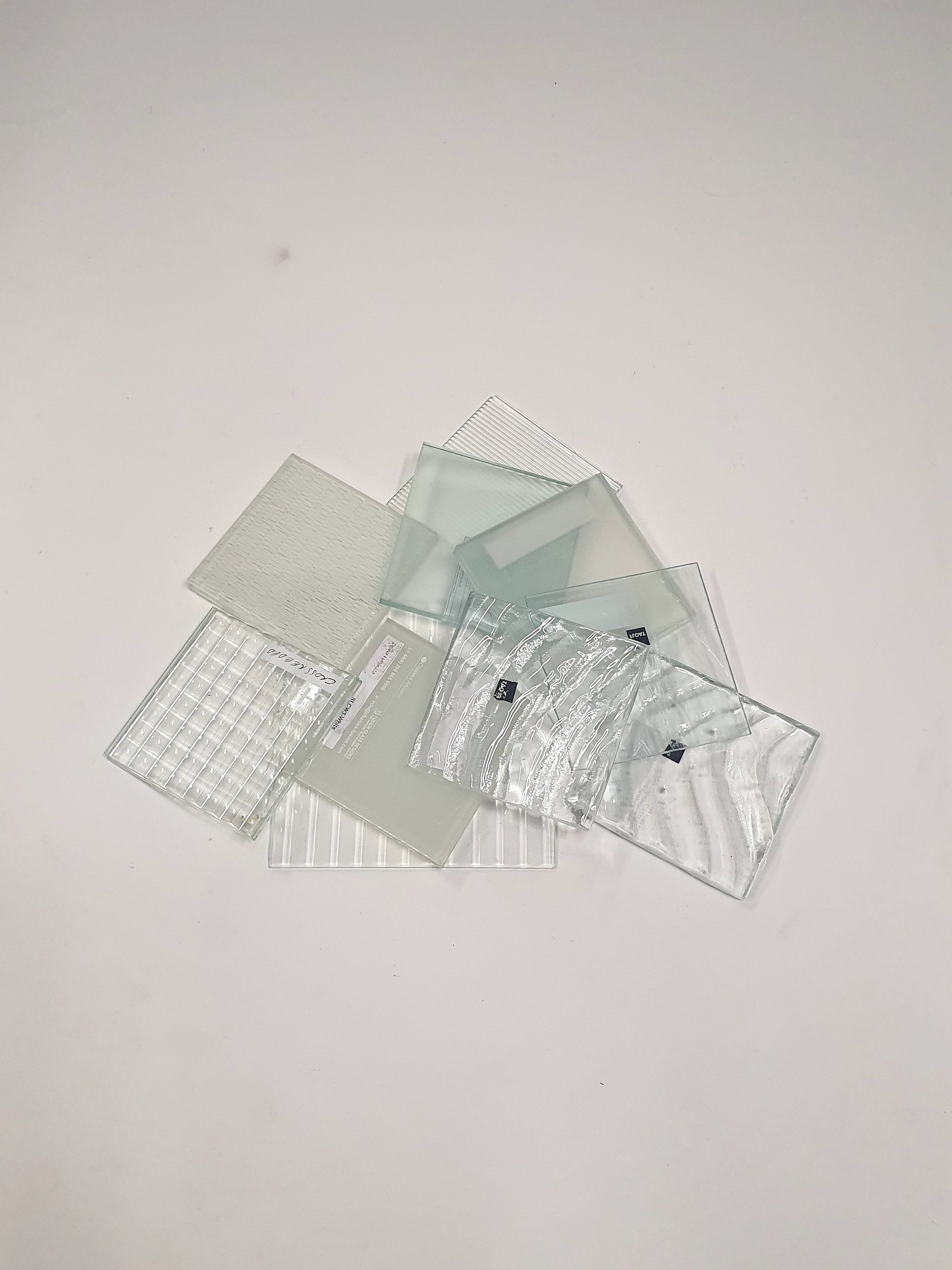 Pile of square transparent glass samples 