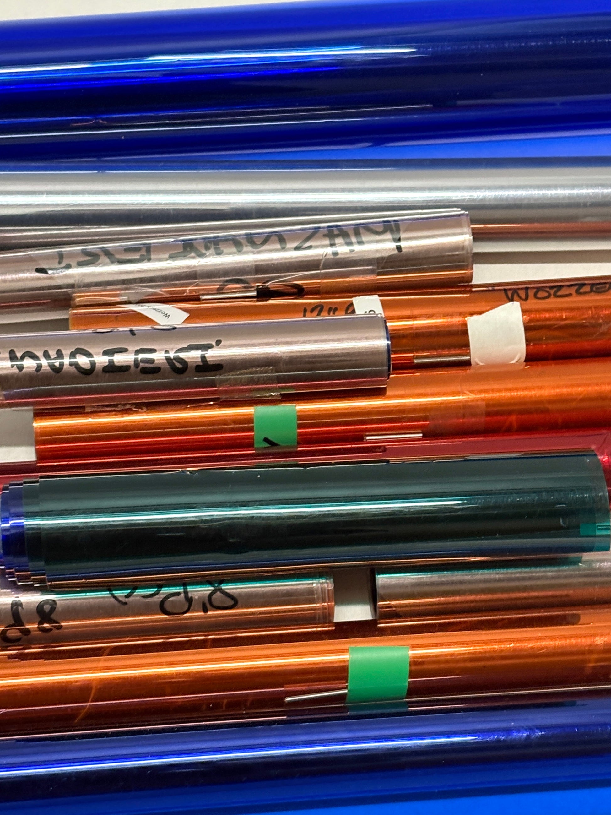 Collection of colourful glossy paper plastic rolls 