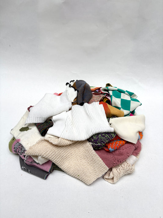 Pile of colourful knitting samples 