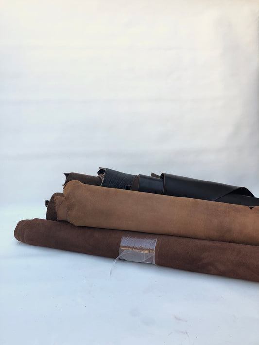 Collection of dark brown rolled leather