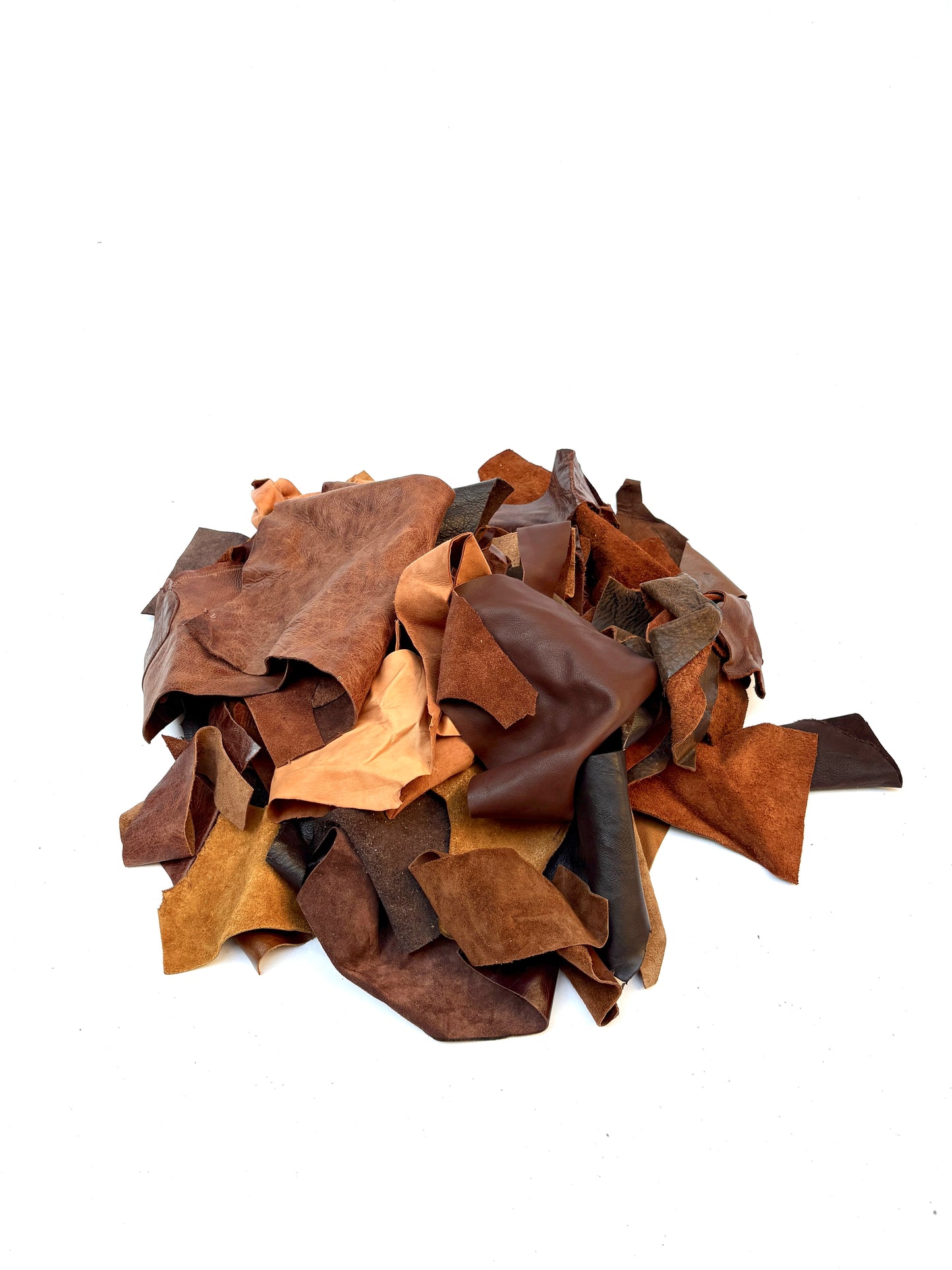 Pile of various types of brown leather offcuts