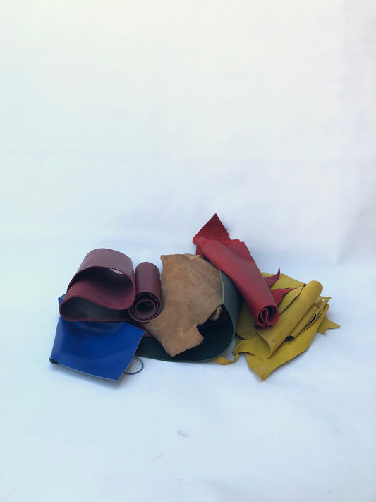 Pile of offcuts of leather with various colours, various sizes 