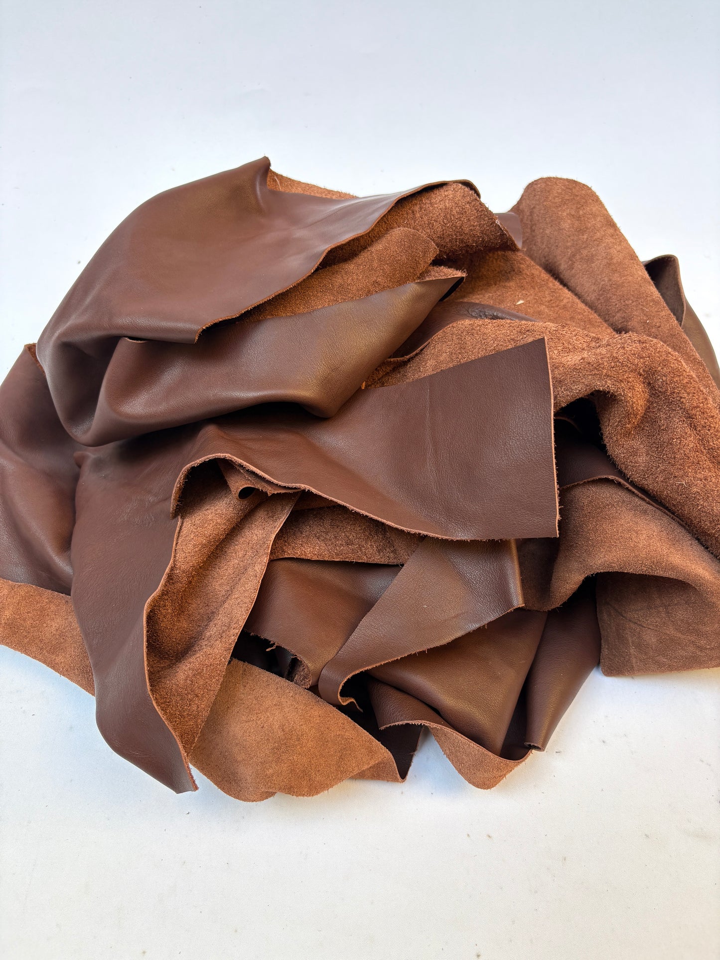 Pile of light brown leather offcuts 