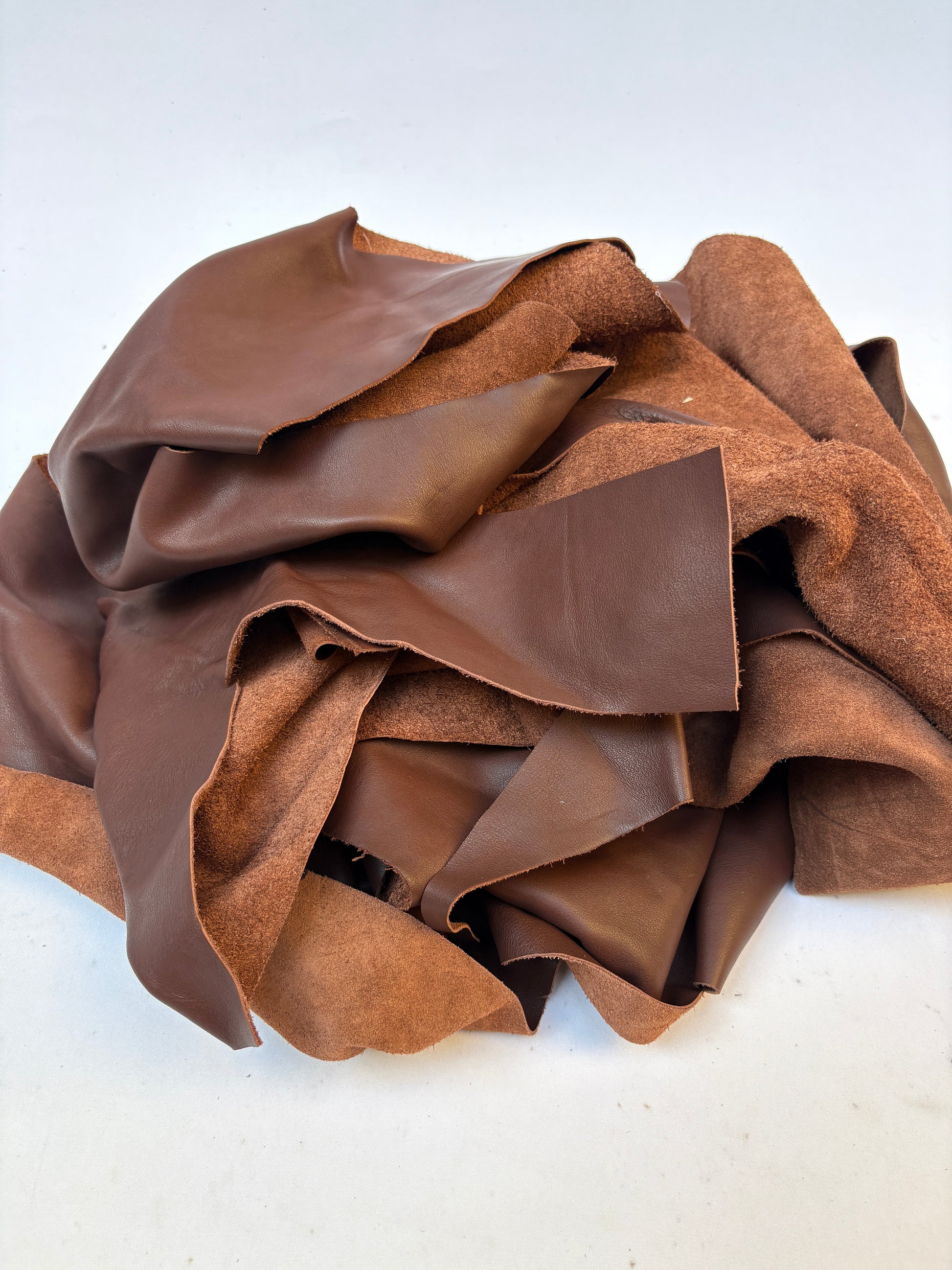 Pile of light brown leather offcuts 