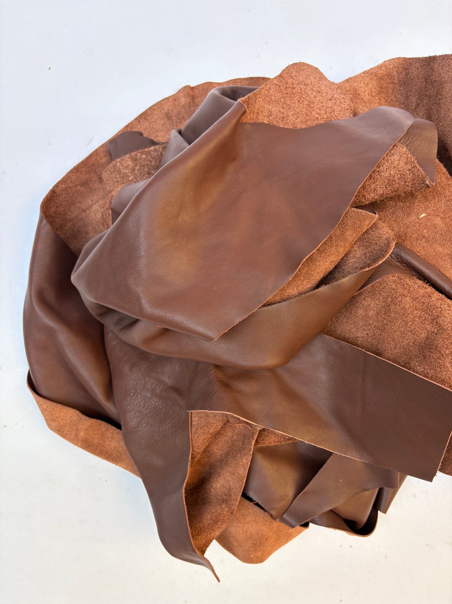 Pile of  light brown leather offcuts 