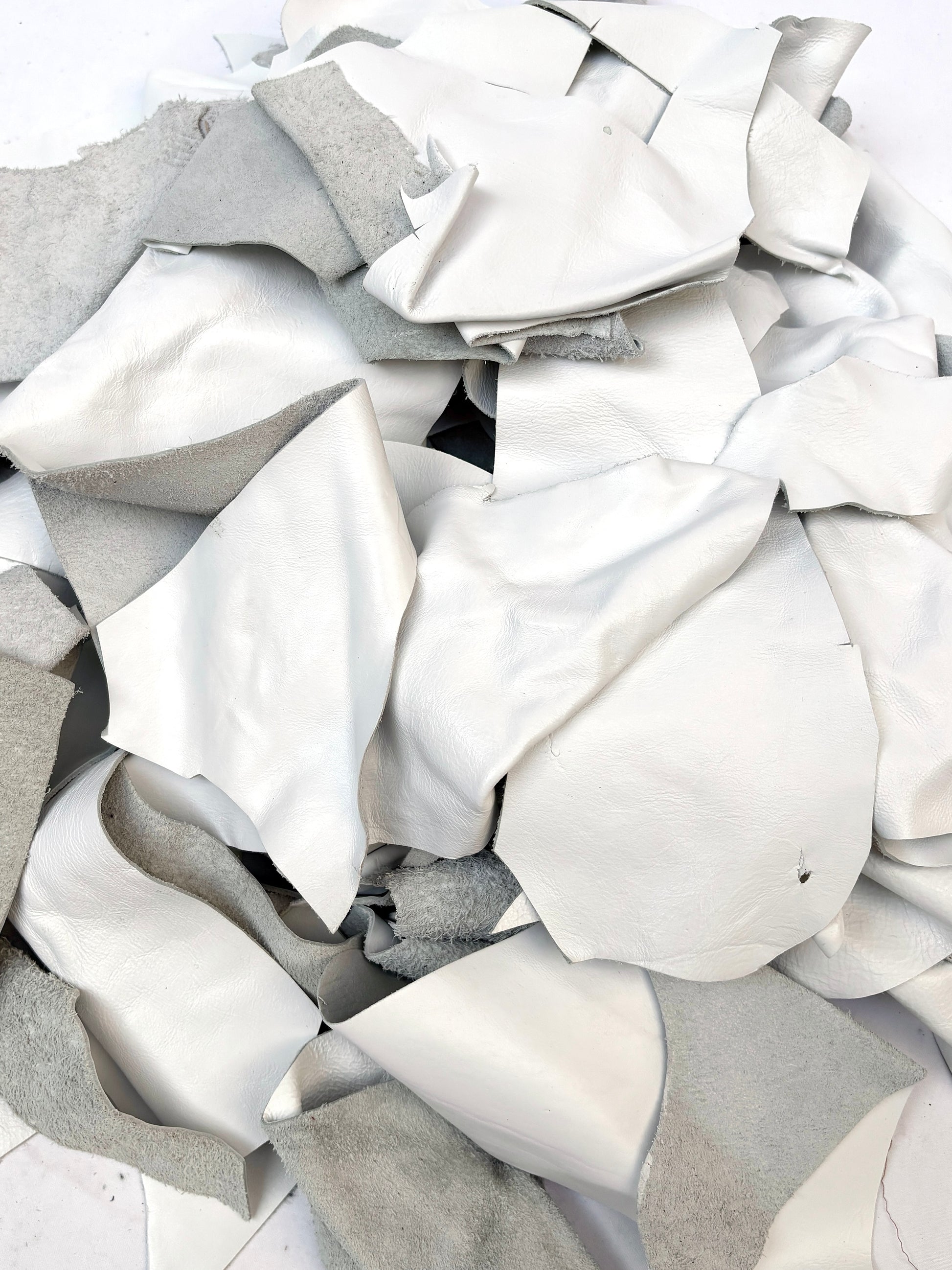 Close-up of white off-cut leather pieces 
