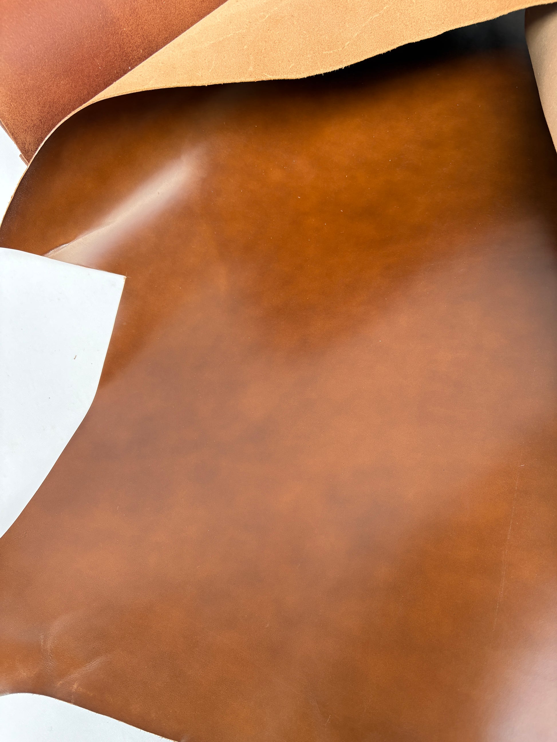 Close-up of brown leather pieces shiny surface 
