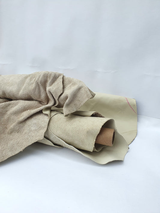 Unfolded cowhide bone white rolled leather with visible marking lines