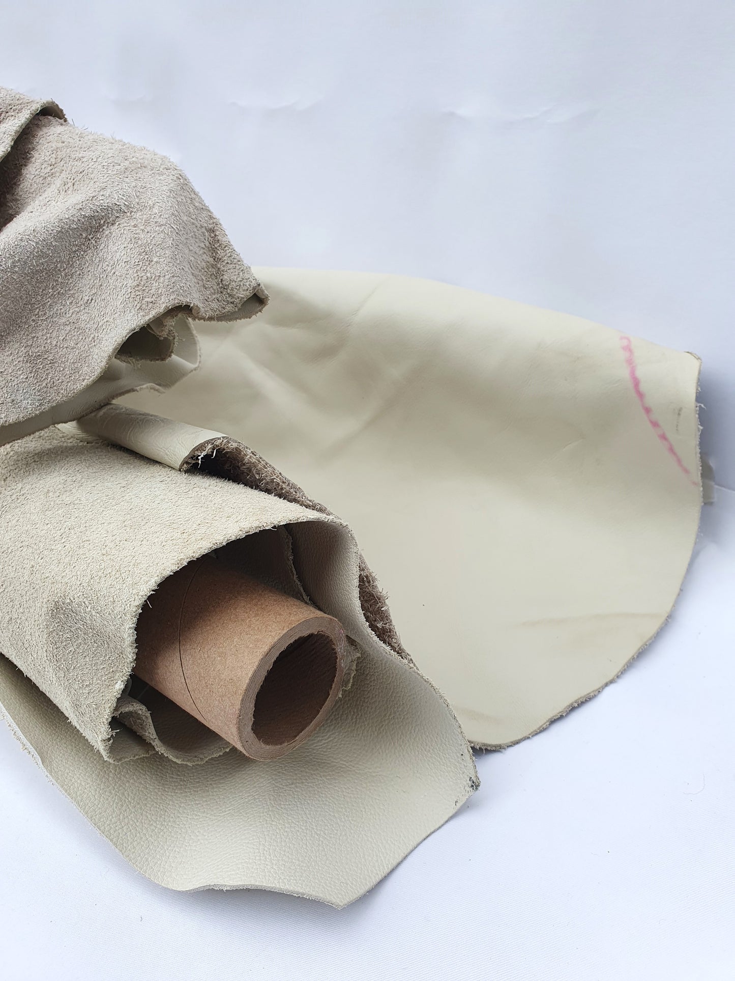 Unfolded cowhide bone white rolled leather with visible marking lines
