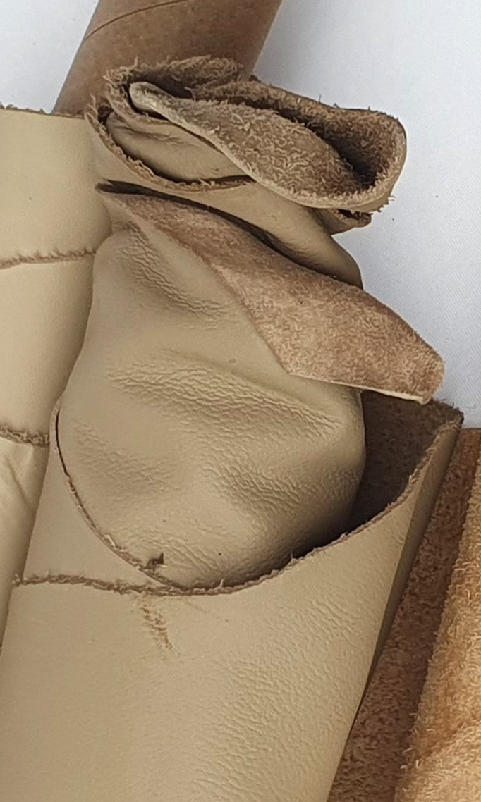 Two cowhide camel rolled leather with visible texture 