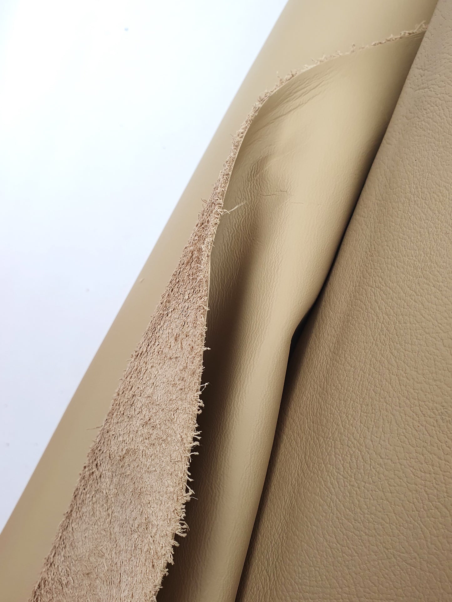 Cowhide camel rolled leather with visible textures 