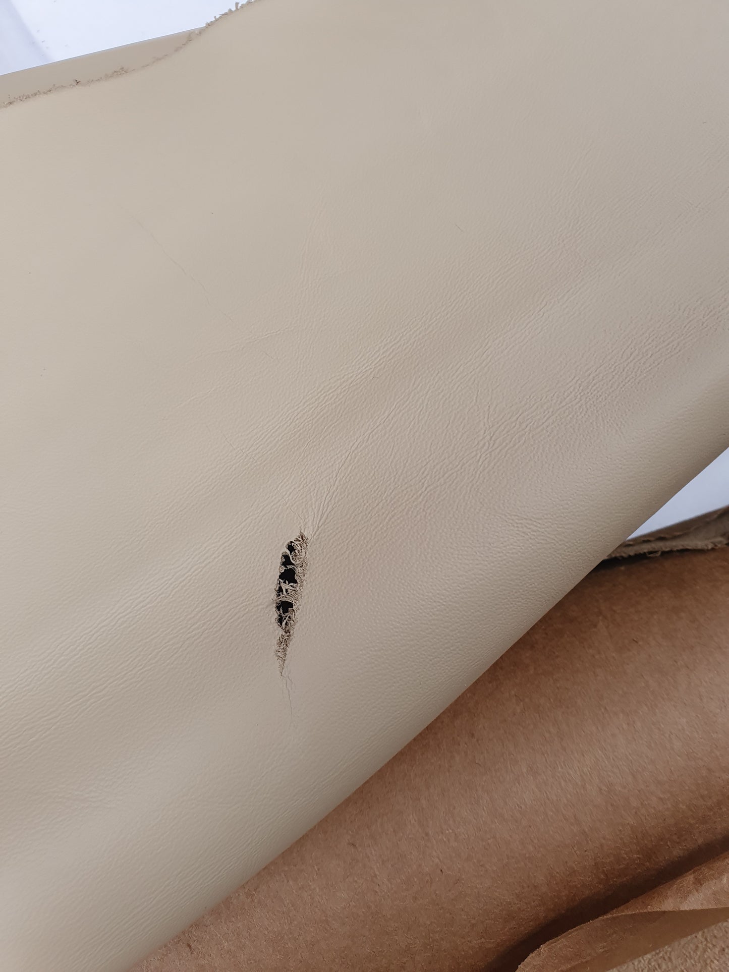 Two cowhide camel rolled leather with some holes 