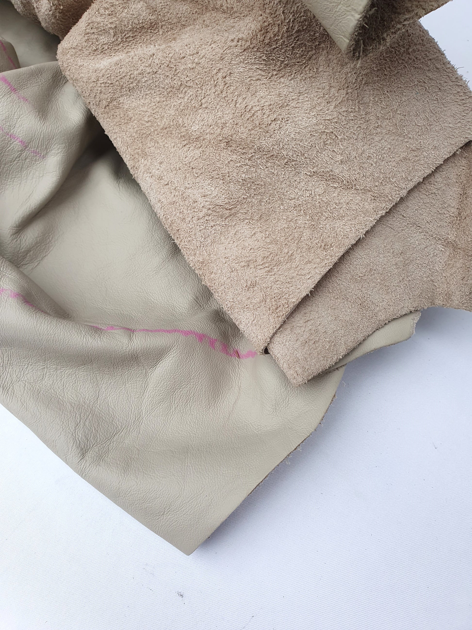 Beige coloured rolled leather with visible marking lines 