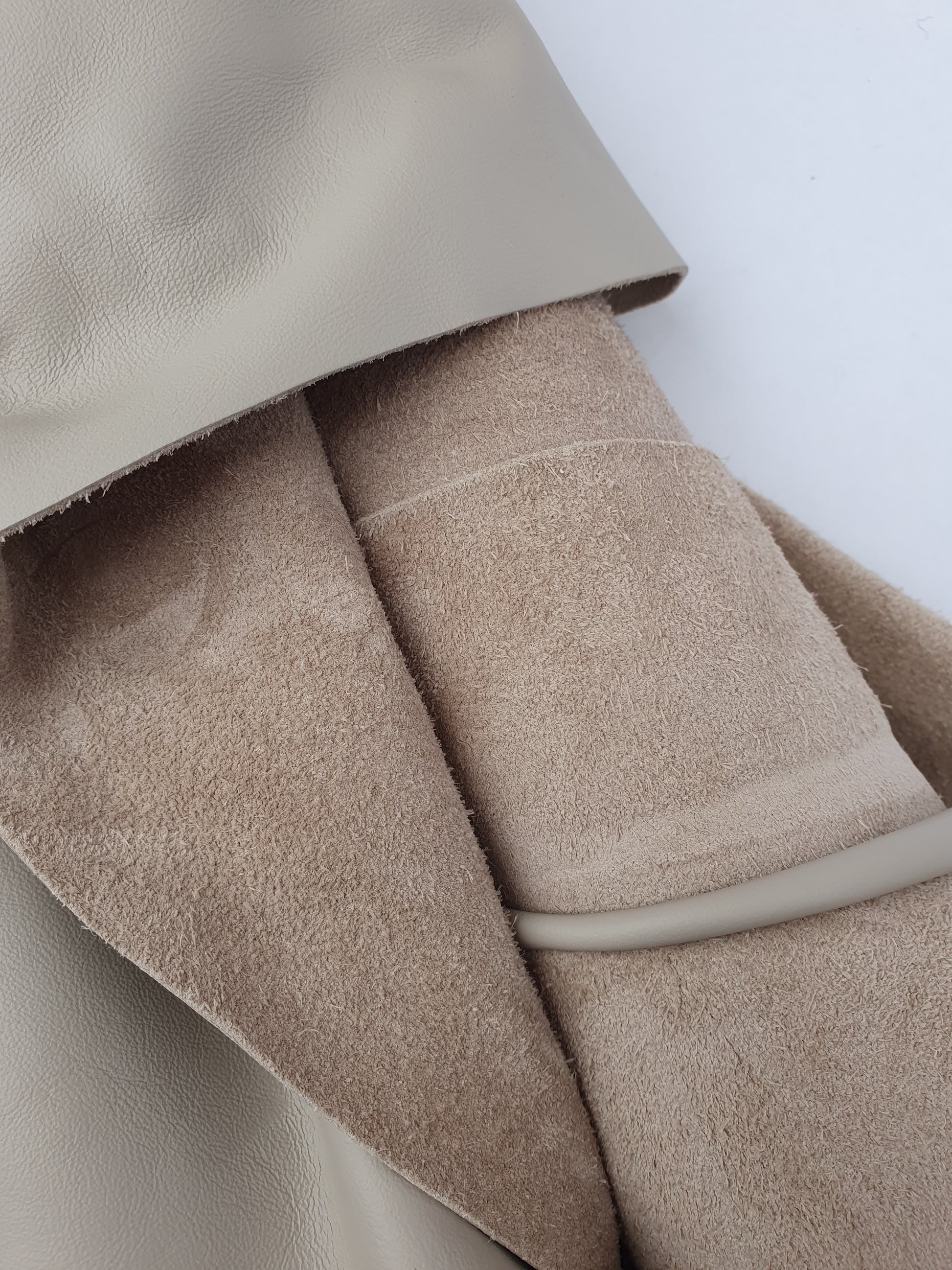 Close-up of beige coloured rolled leather 
