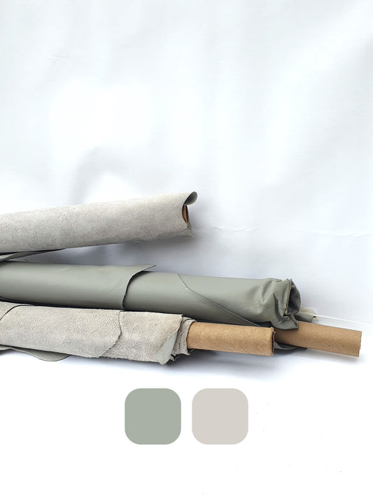 Collection of rolled leather in different shades of gray with colour swatches 