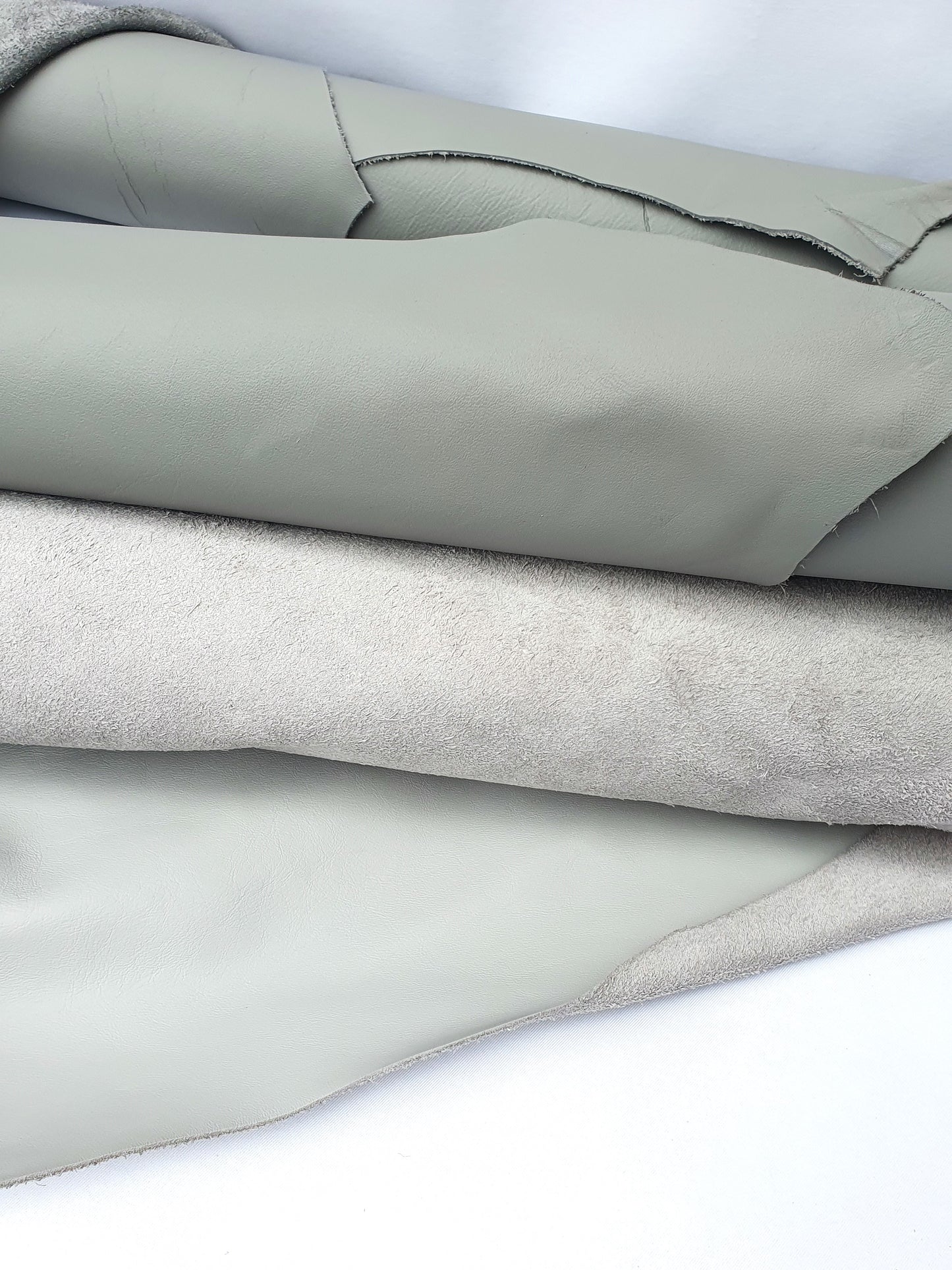 Two rolled leather in grey and light grey 