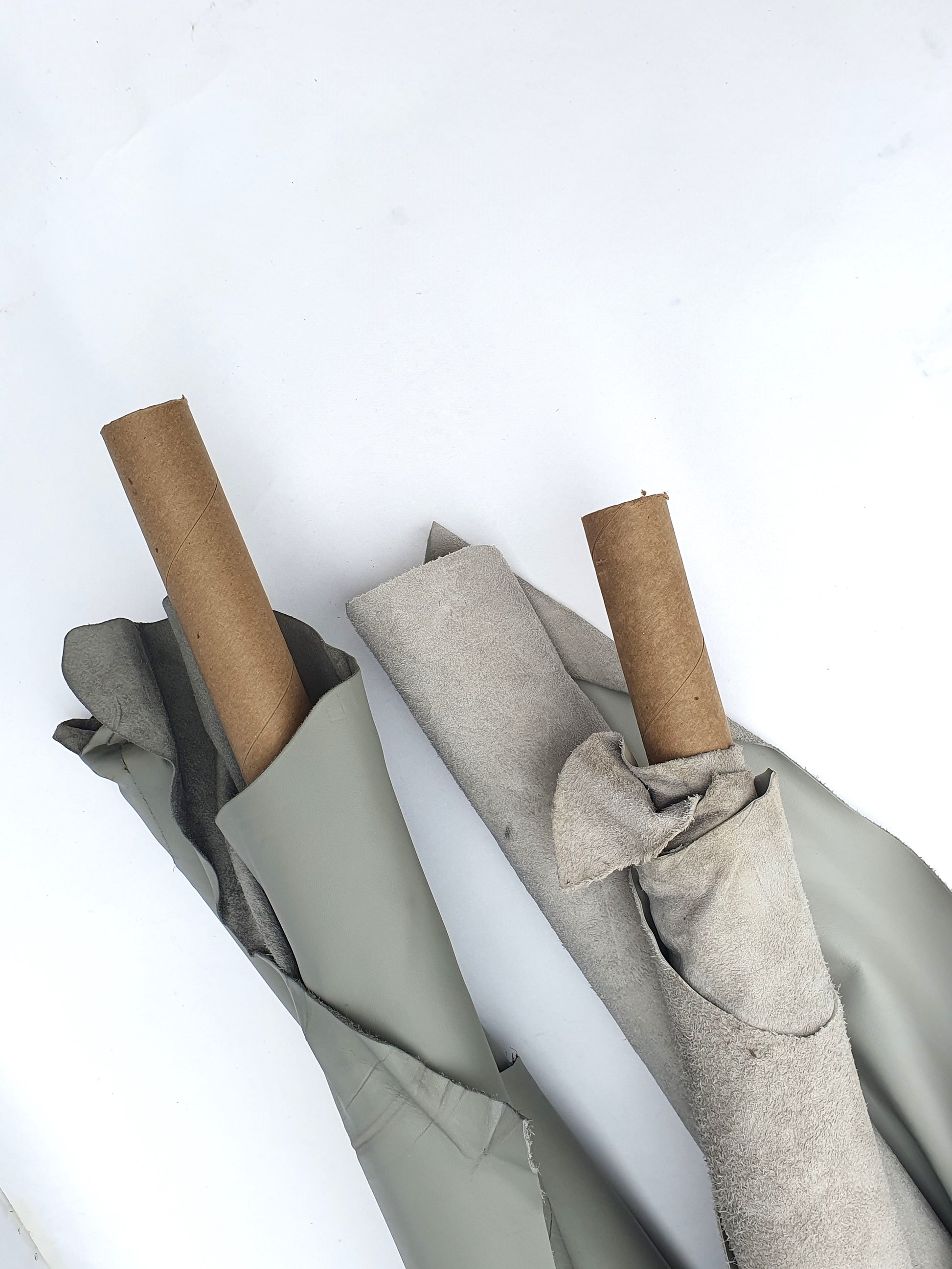 Two rolled leather in grey and light grey 