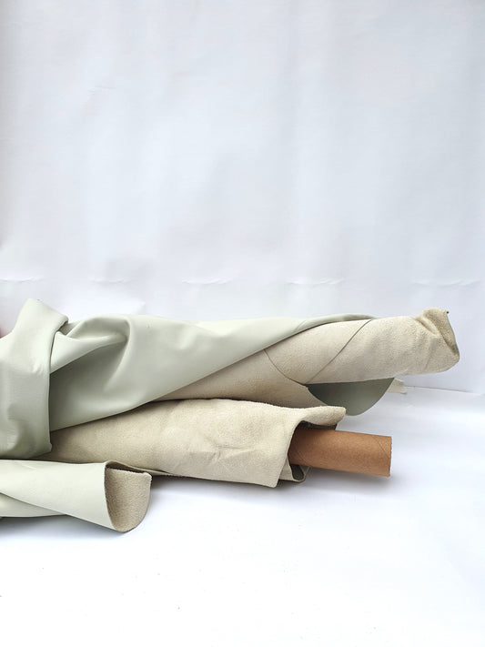 Collection of rolled cream coloured leathers