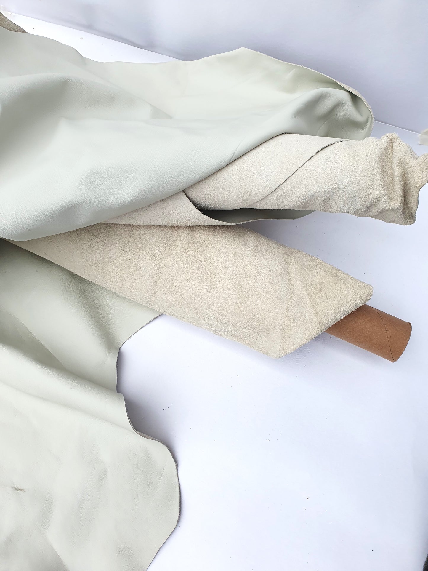 Rolled cream coloured leather, texture visible