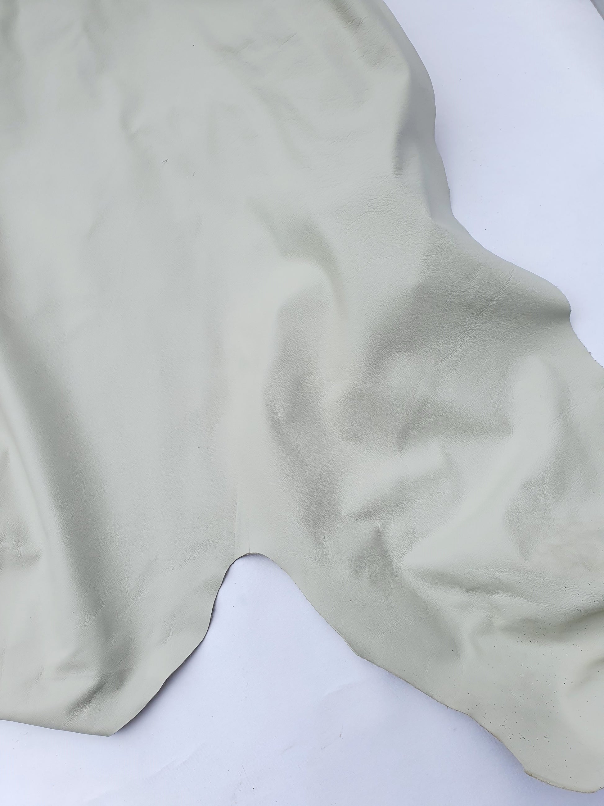 Unfolded cream coloured leather 
