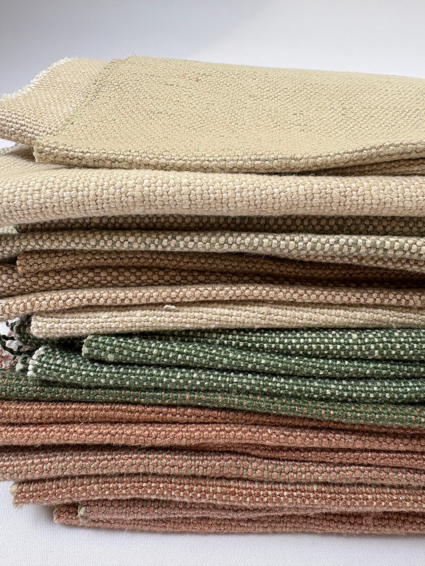Stack of linen fabric swatches in various colours 