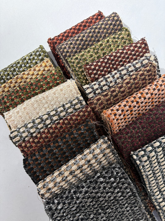Assorted long fabric offcuts with shimmer patterns arranged on a white background.