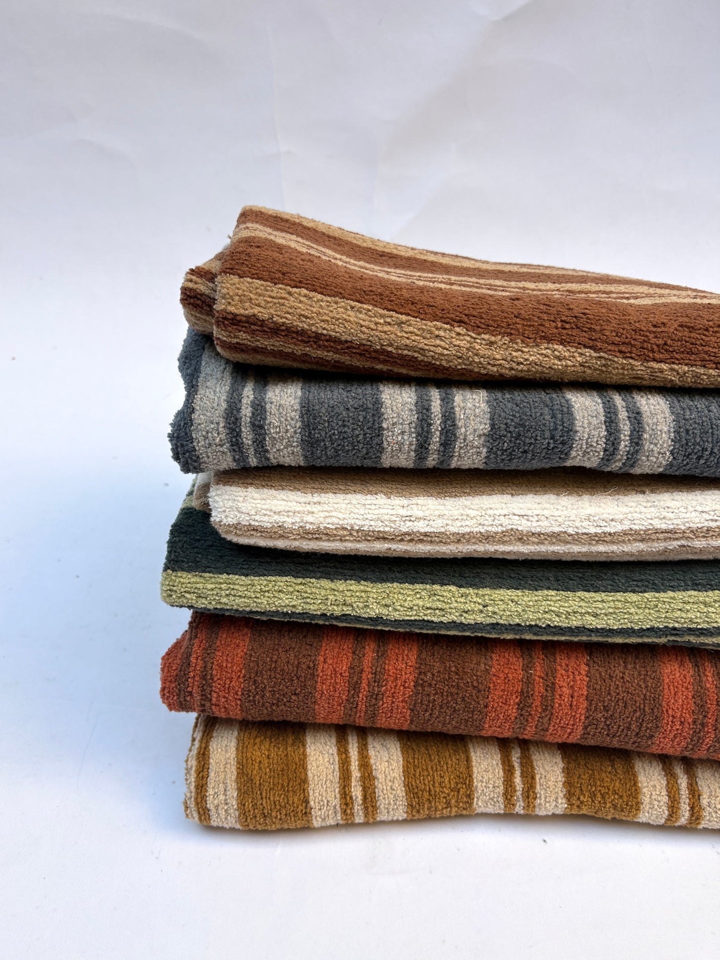 Stack of striped patterned fabric in various colours