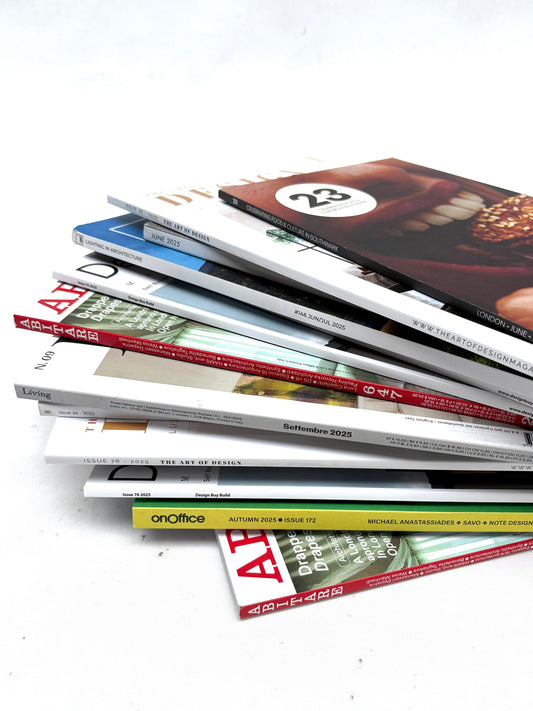 A stack of magazines, various sizes