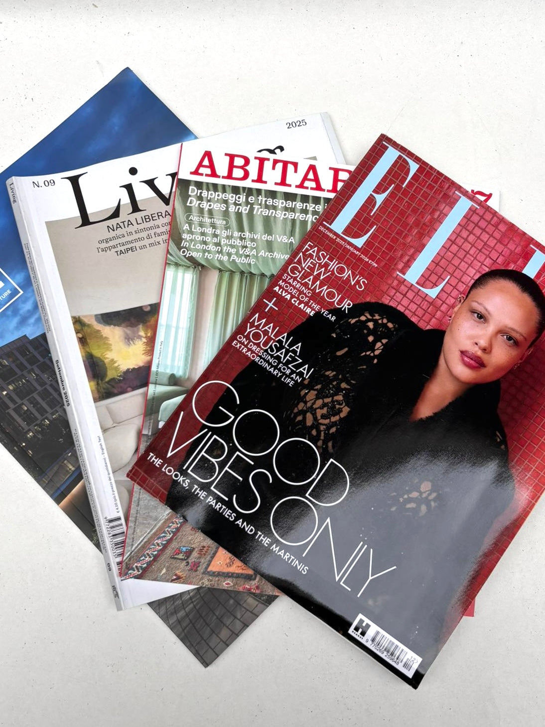 Selection of mixed magazines laid out on a white background.