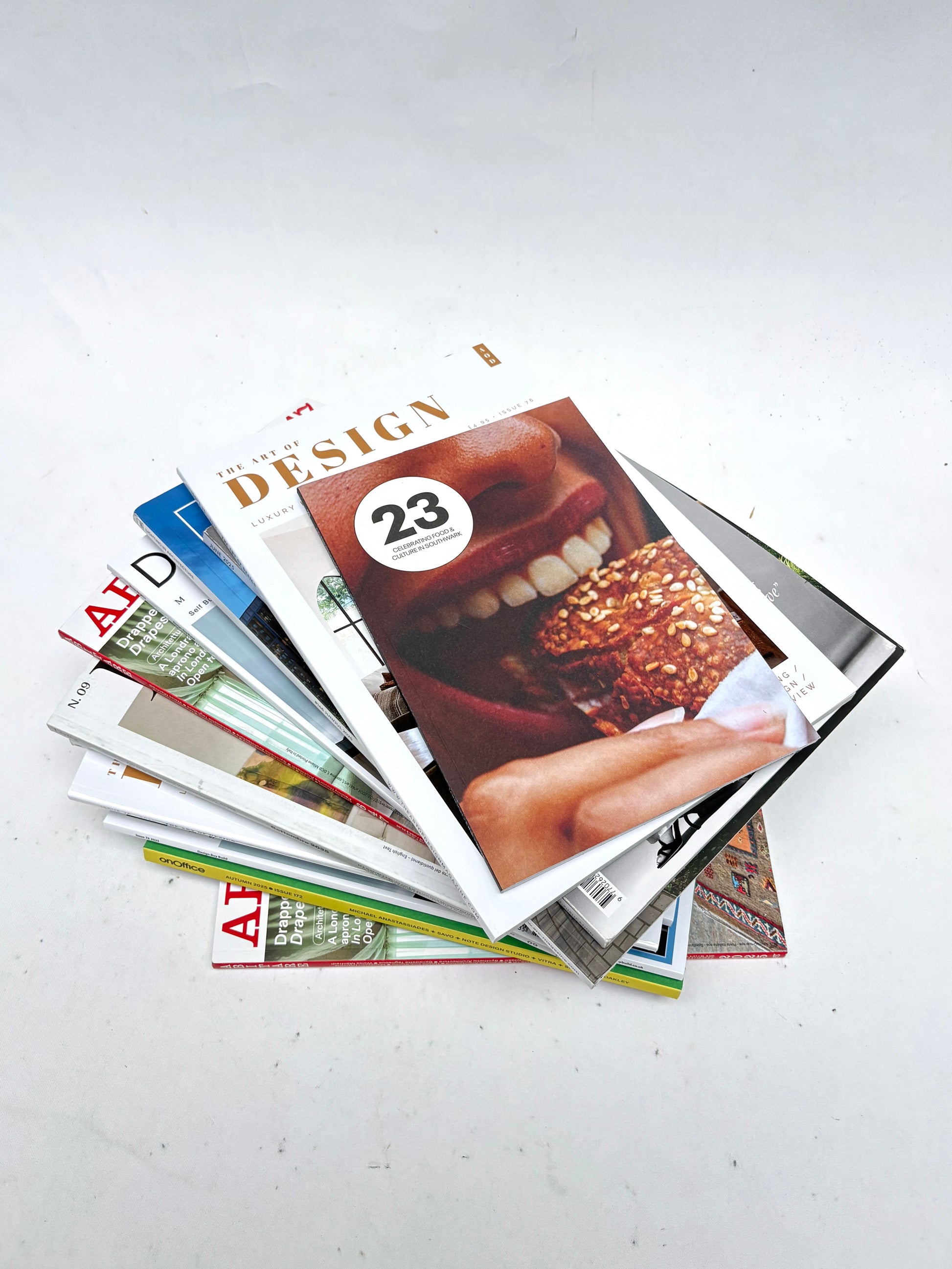 A stack of magazines, various sizes