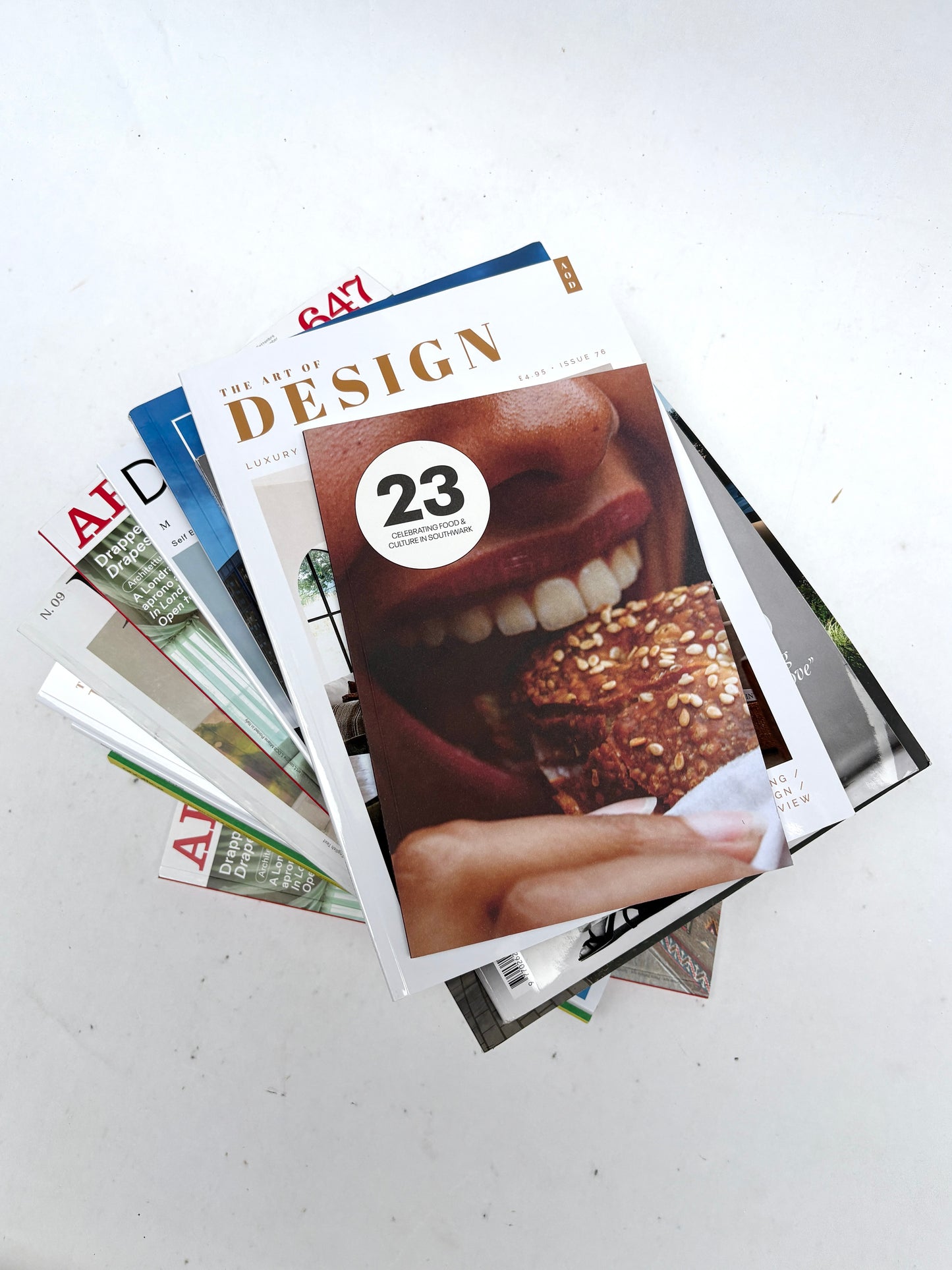 A stack of magazines, various sizes