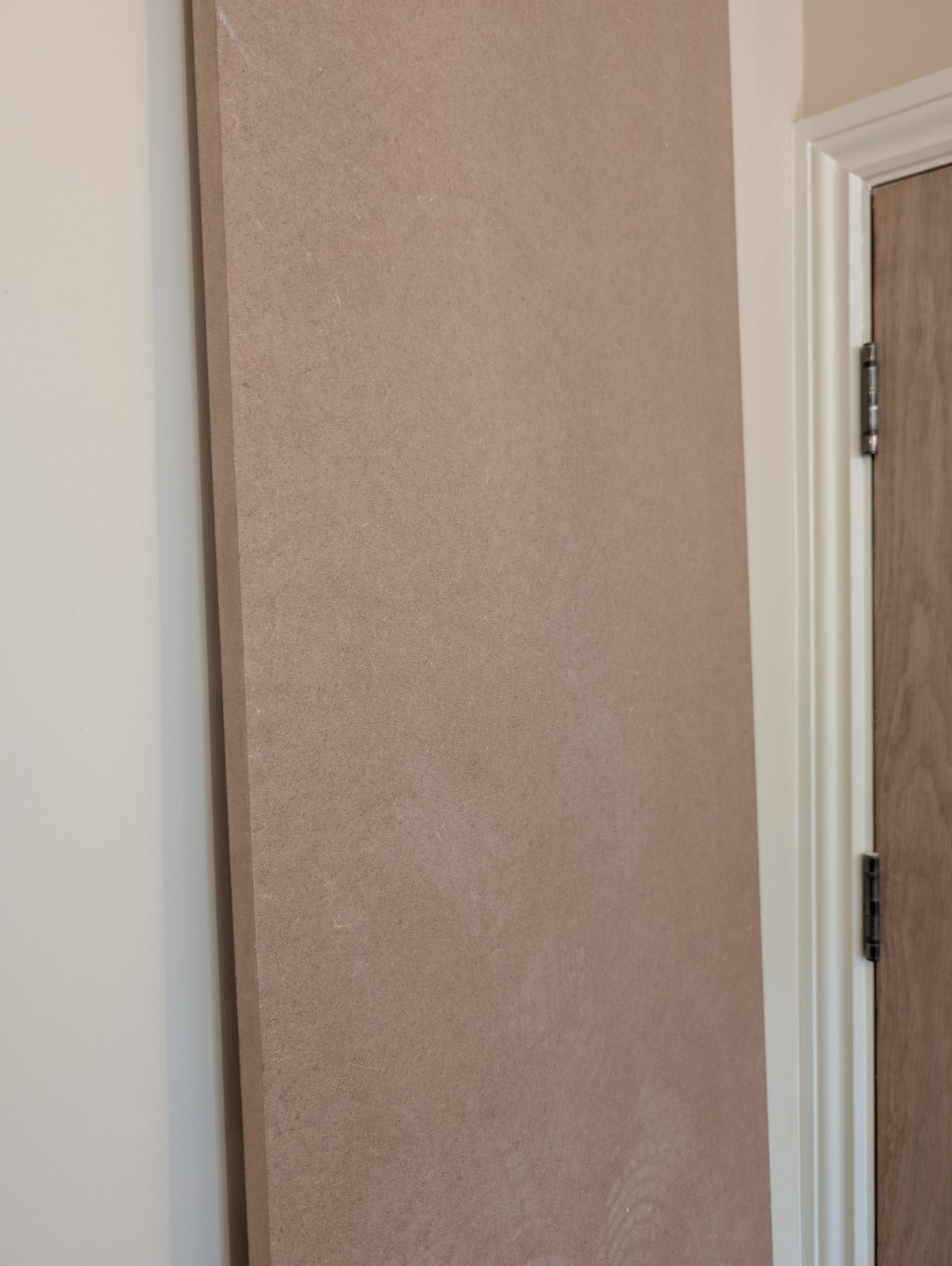 Close-up of a light brown rectangular MDF sheet