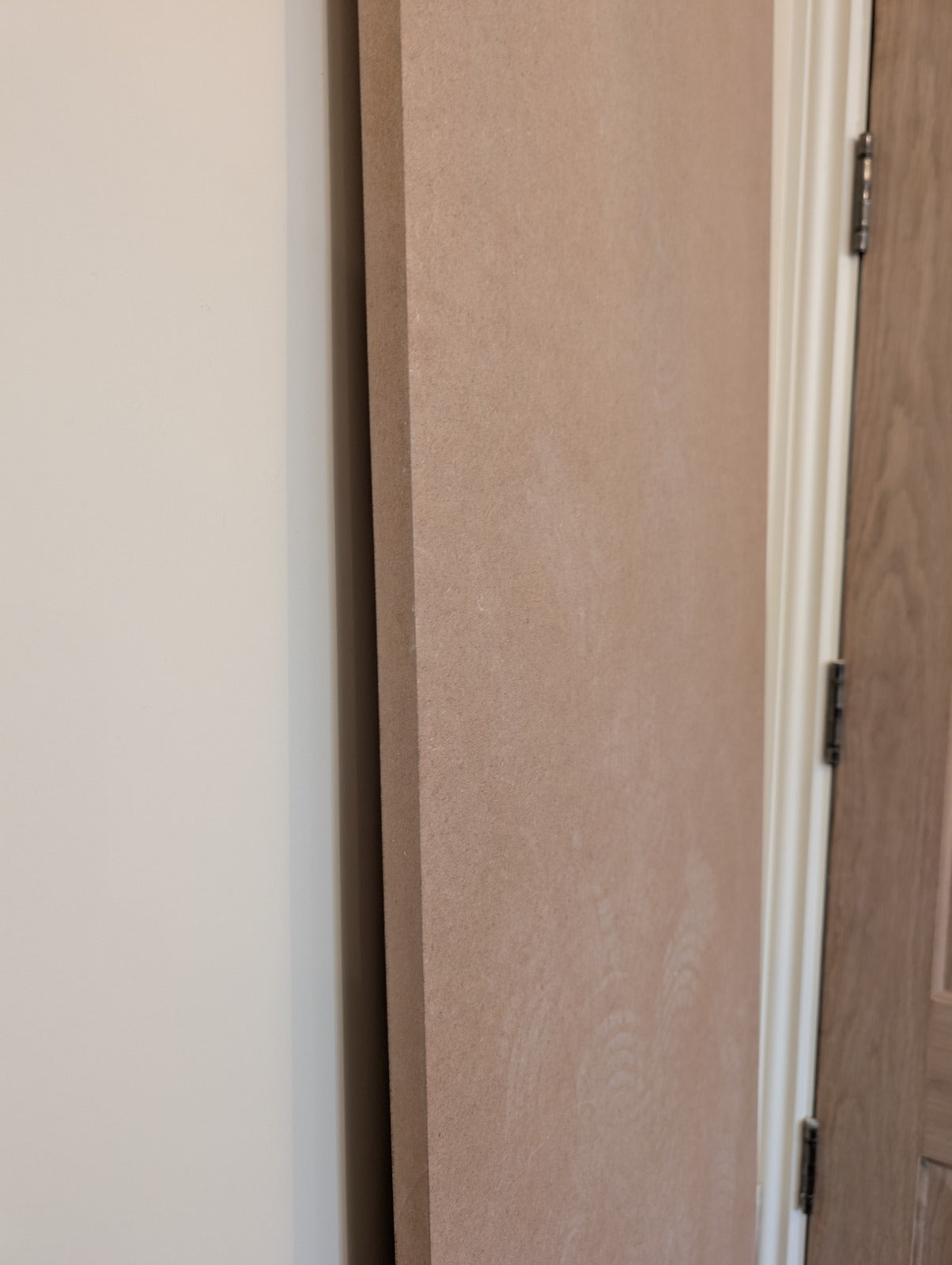 Close-up of a light brown rectangular MDF sheet