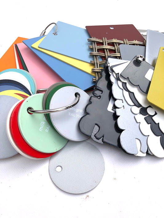 Close-up of colourful metal sample bundles with various forms