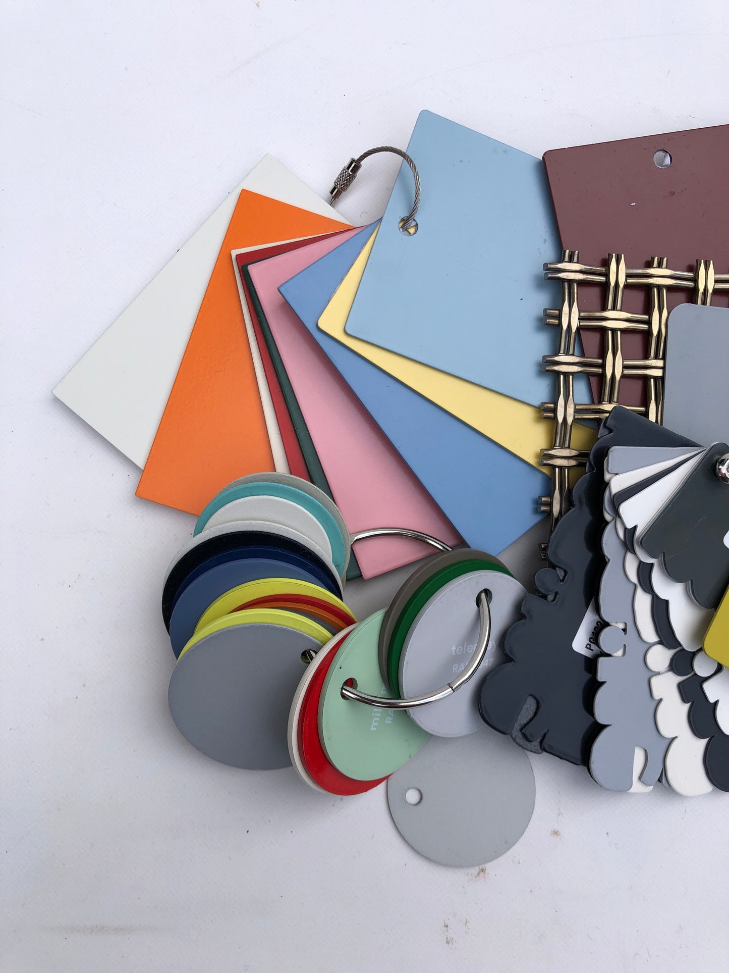 Close-up of colourful metal sample bundles with various forms