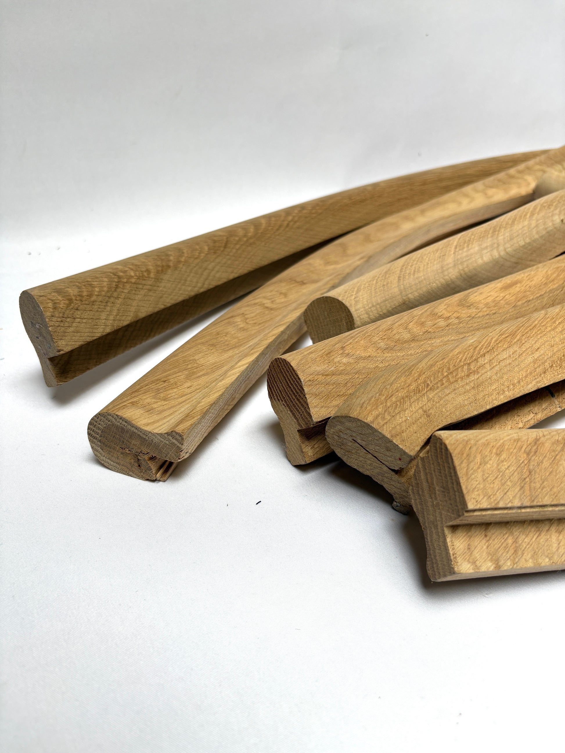 Close-up of collection of oak volute wooden pieces 