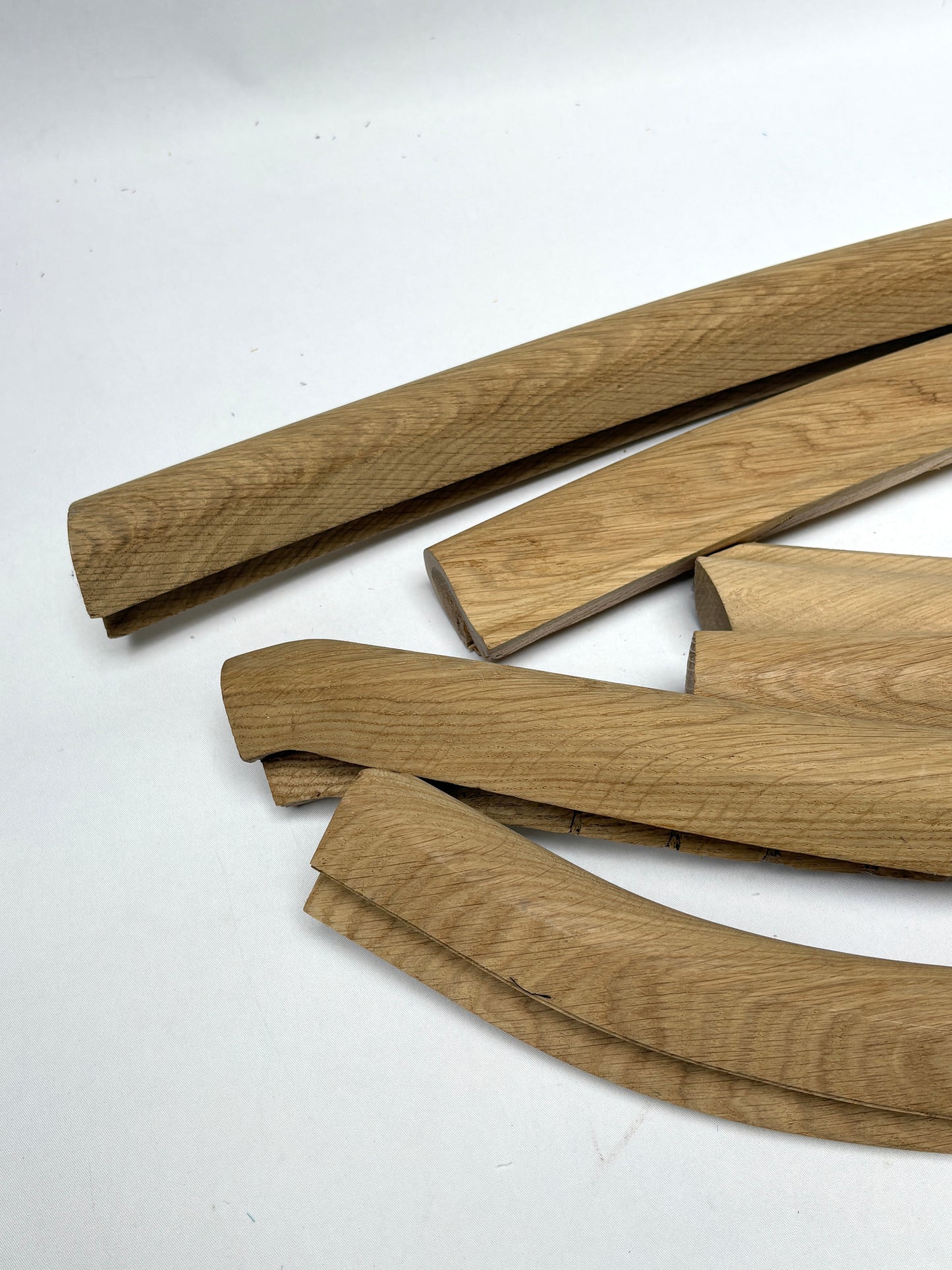 Close-up of collection of oak volute wooden pieces 