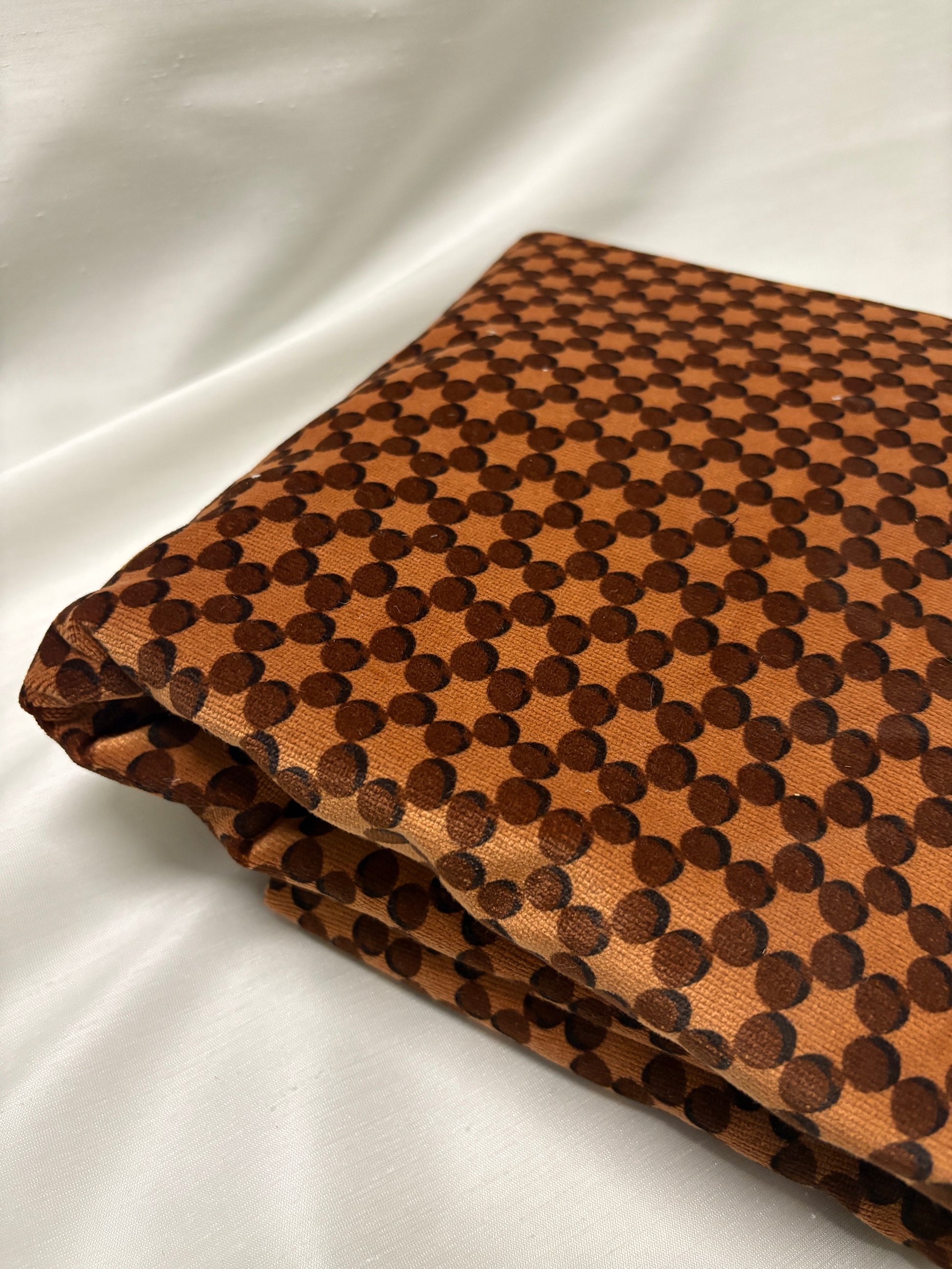 Orange dot patterned velvet fabric